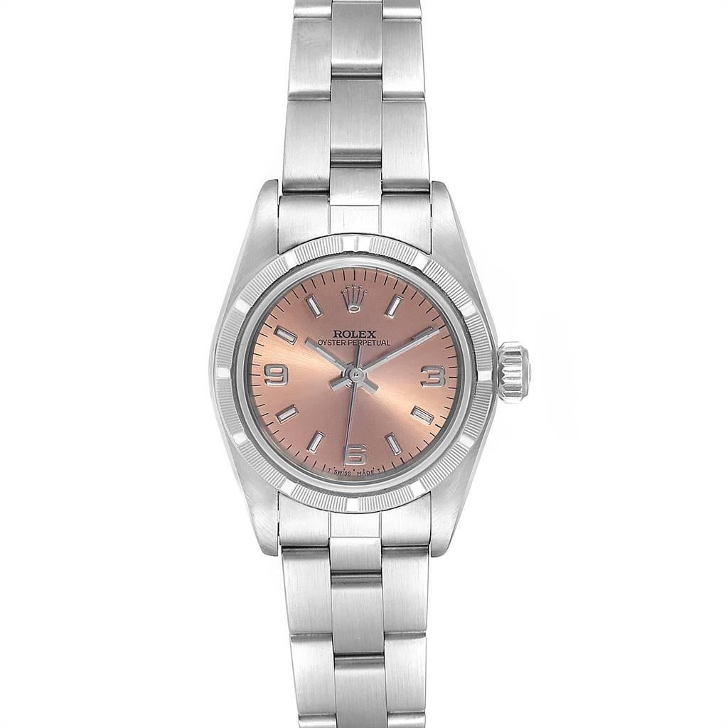 Rolex Oyster Perpetual Salmon Dial Oyster Bracelet Ladies Watch 67230. Officially certified chronometer self-winding movement. Stainless steel oyster case 24.0 mm in diameter. Rolex logo on a crown. Stainless steel engine turned bezel. Scratch