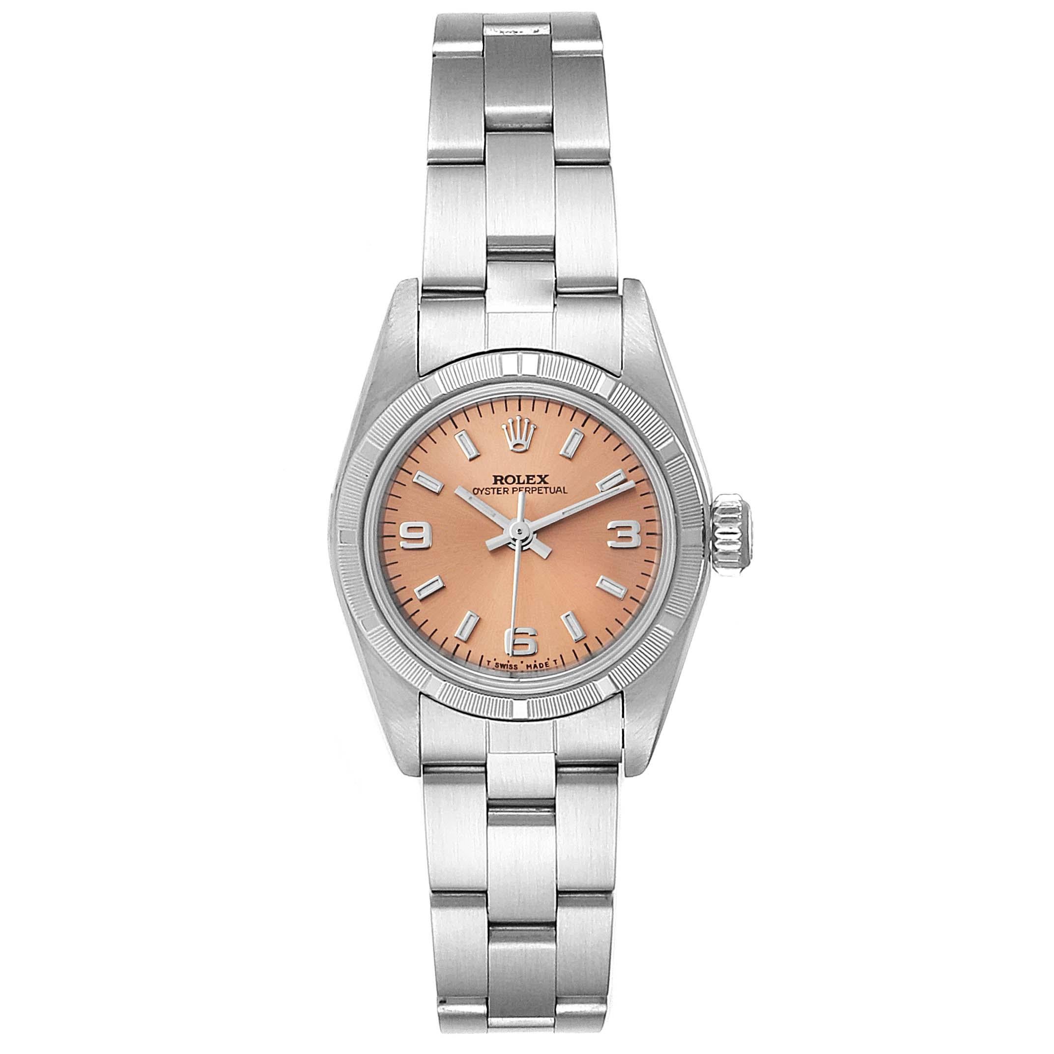 Rolex Oyster Perpetual Salmon Dial Oyster Bracelet Ladies Watch 67230. Officially certified chronometer self-winding movement. Stainless steel oyster case 24.0 mm in diameter. Rolex logo on a crown. Stainless steel engine turned bezel. Scratch