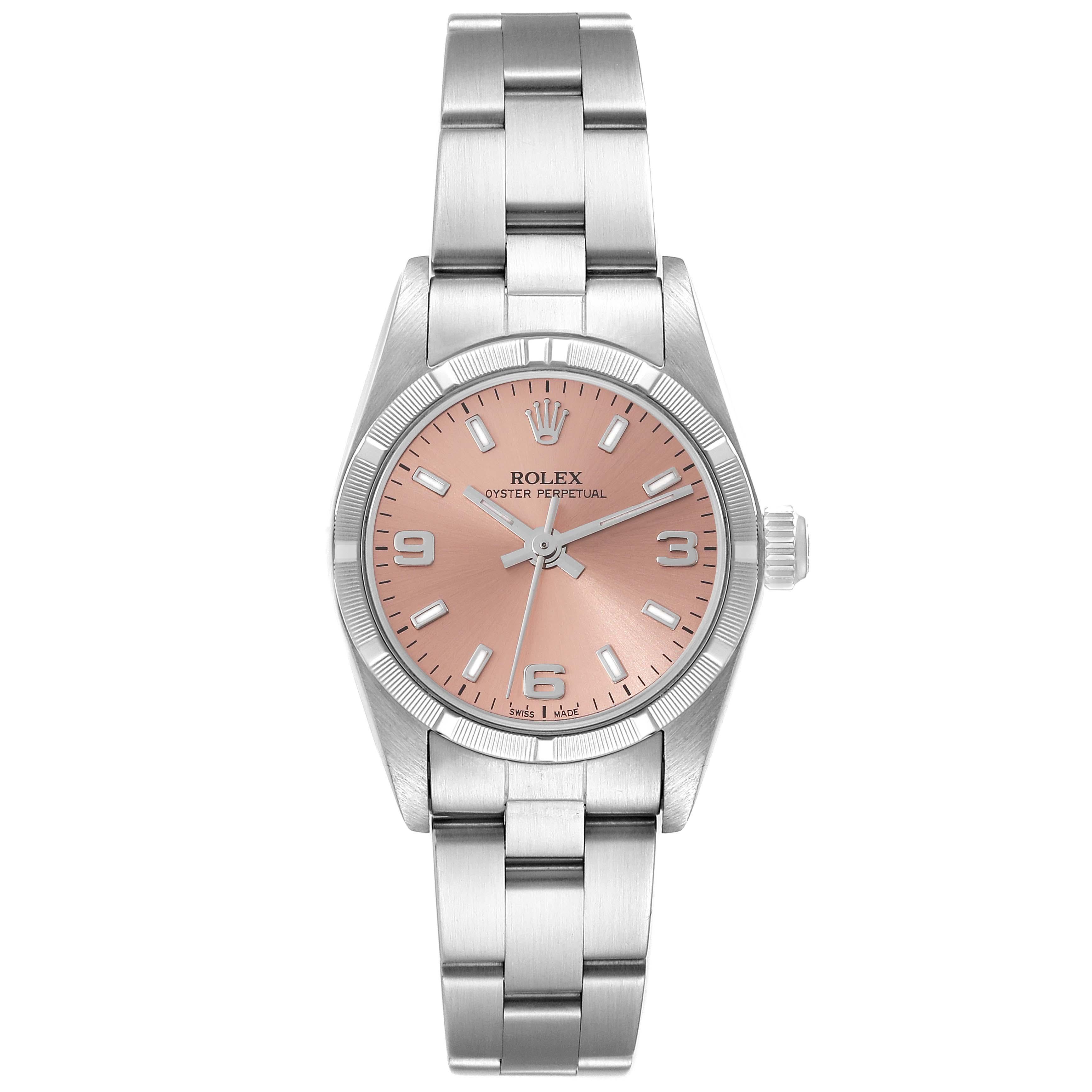 Rolex Oyster Perpetual Salmon Dial Steel Ladies Watch 76030. Officially certified chronometer automatic self-winding movement. Stainless steel oyster case 24.0 mm in diameter. Rolex logo on the crown. Stainless steel engine turned bezel. Scratch