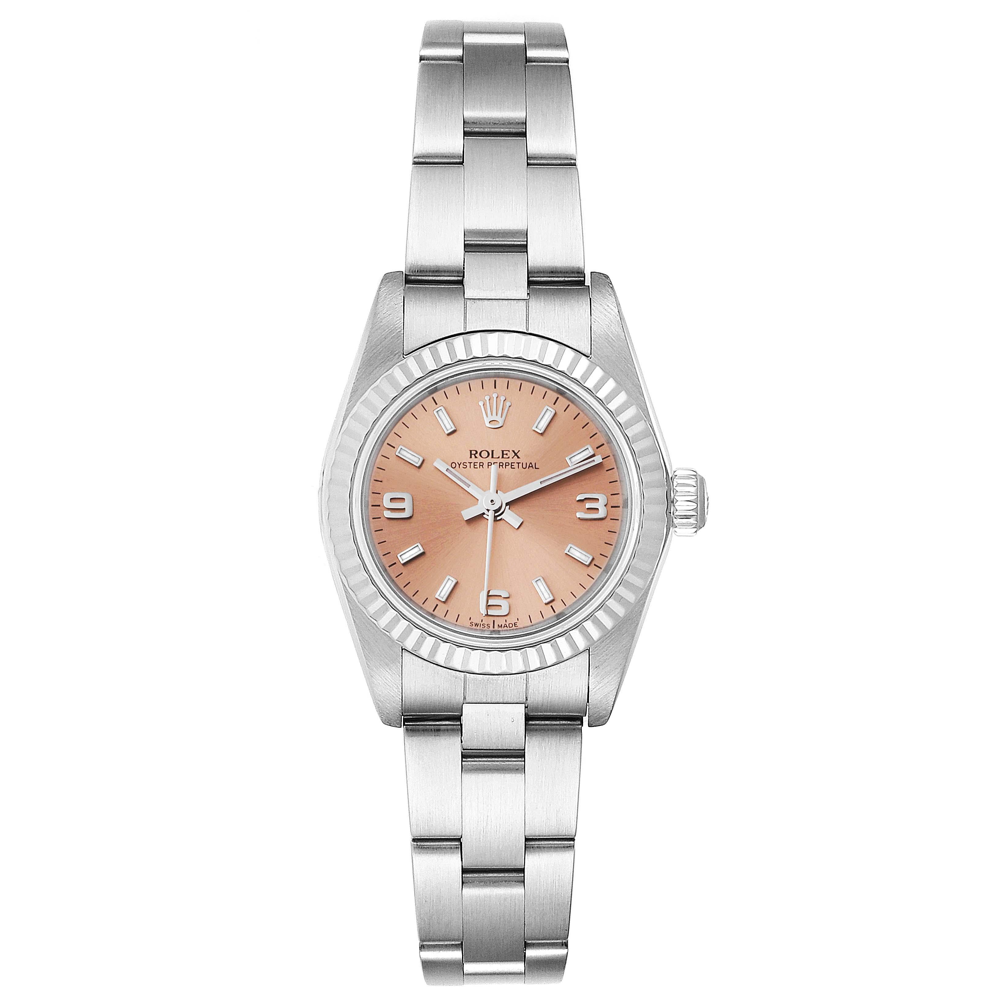 Rolex Oyster Perpetual Salmon Dial Steel White Gold Ladies Watch 76094. Officially certified chronometer self-winding movement. Stainless steel oyster case 24.0 mm in diameter. Rolex logo on a crown. 18k white gold fluted bezel. Scratch resistant