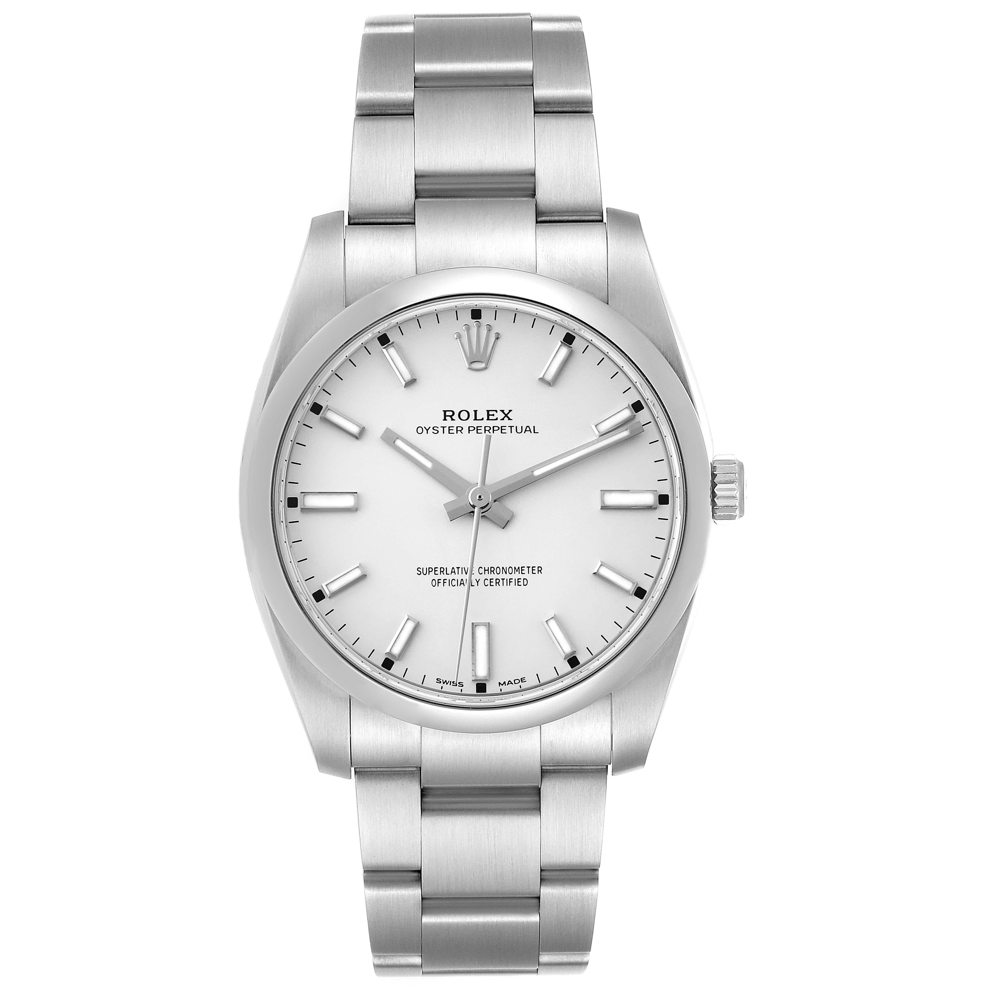 Rolex Oyster Perpetual Silver Dial Smooth Bezel Mens Watch 114200 Box Card. Officially certified chronometer self-winding movement. Stainless steel case 34 mm in diameter. Rolex logo on a crown. Stainless steel smooth domed bezel. Scratch resistant