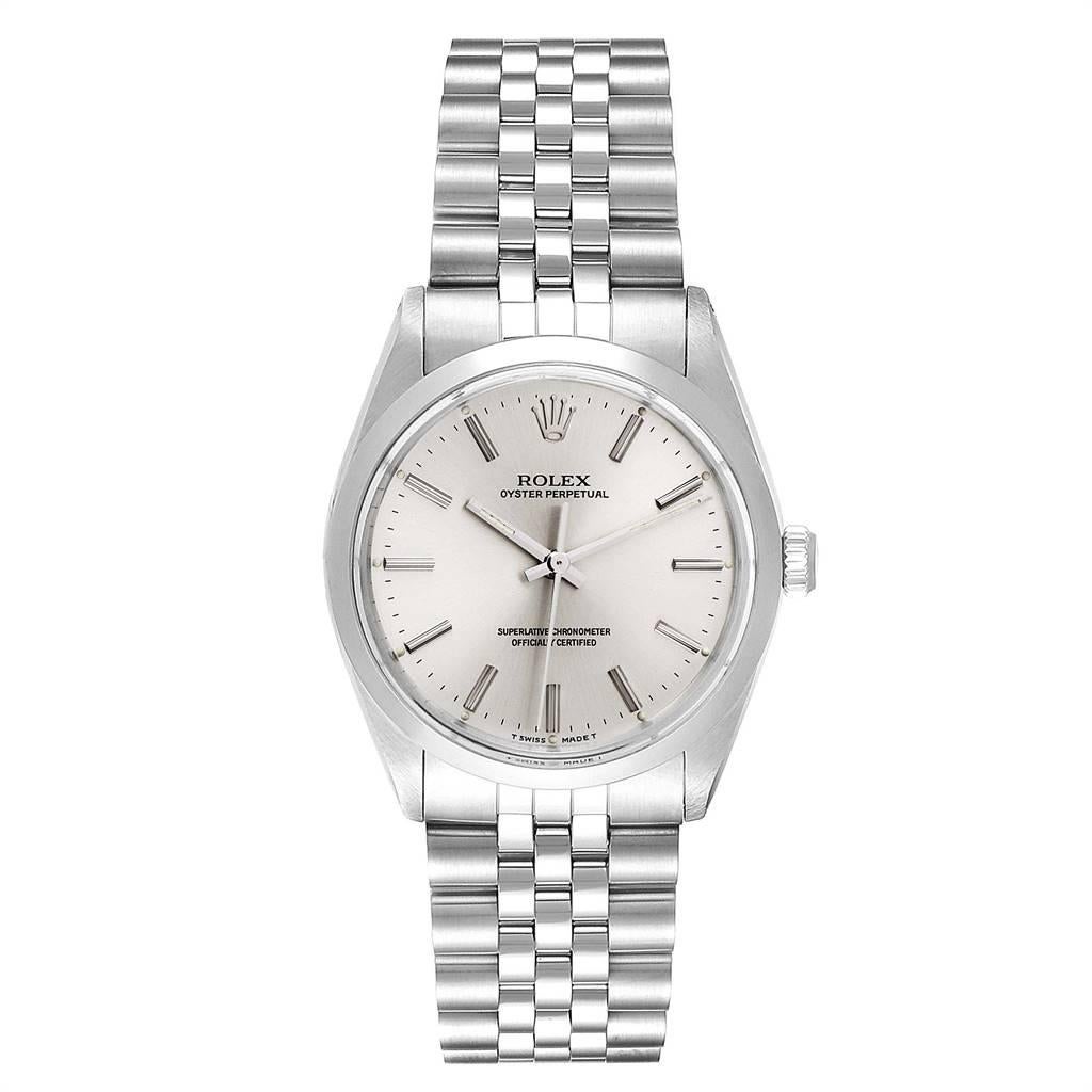 Rolex Oyster Perpetual Silver Dial Vintage Steel Mens Watch 1002. Officially certified chronometer self-winding movement. Stainless steel oyster case 34.0 mm in diameter.  Rolex logo on a crown. Stainless steel smooth bezel. Acrylic crystal. Silver