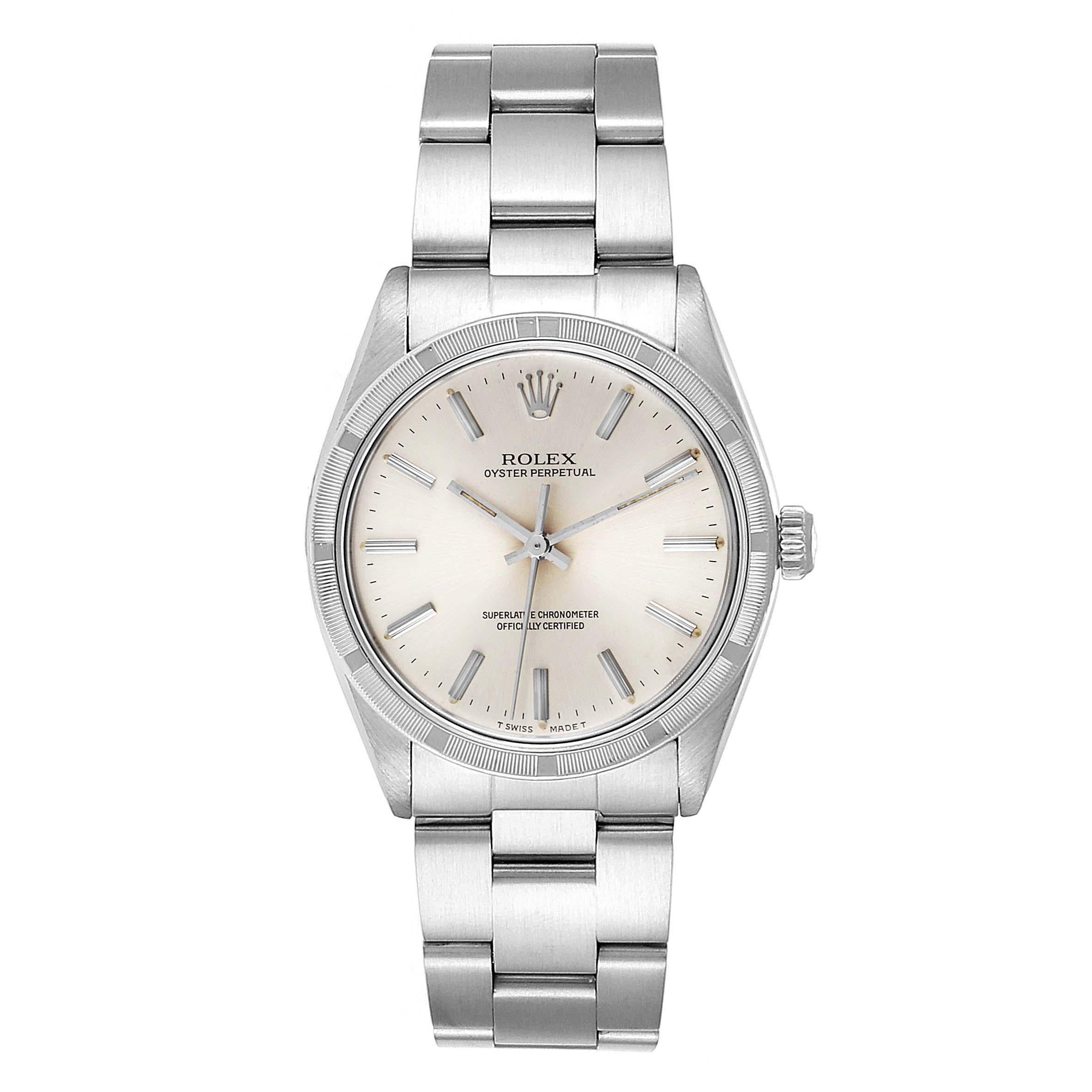Rolex Oyster Perpetual Stainless Steel Vintage Mens Watch 1007. Officially certified chronometer self-winding movement. Stainless steel oyster case 34.0 mm in diameter. Rolex logo on a crown. Stainless steel engine turned bezel. Acrylic crystal.