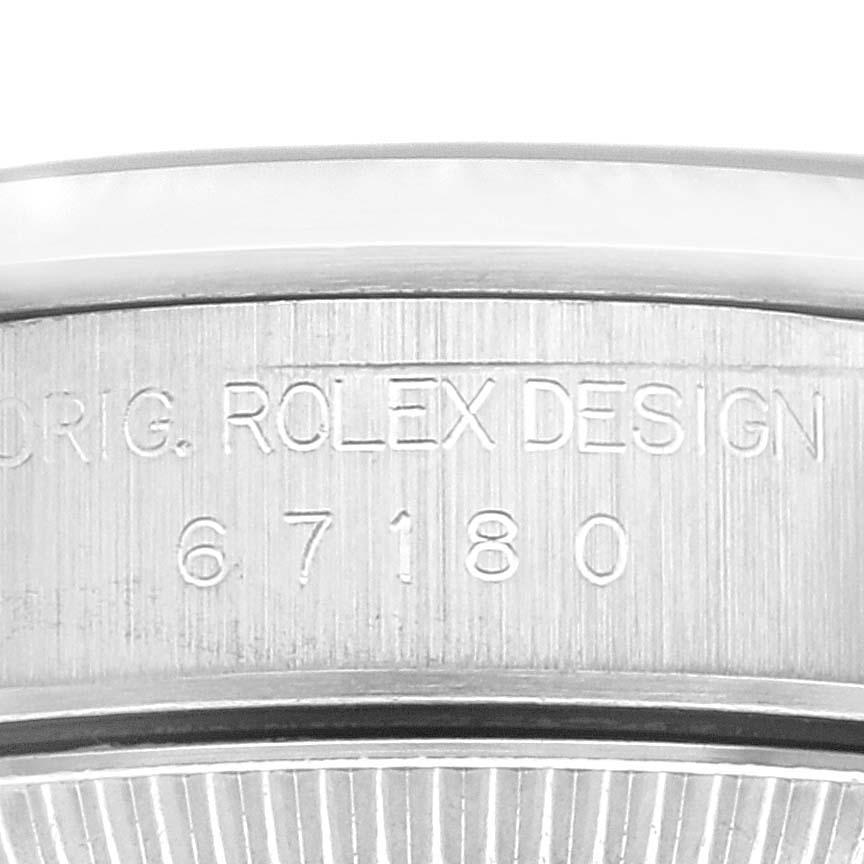 Rolex Oyster Perpetual Steel Black Dial Ladies Watch 67180 Box Papers. Officially certified chronometer automatic self-winding movement. Stainless steel oyster case 24.0 mm in diameter. Rolex logo on a crown. Stainless steel smooth domed bezel.