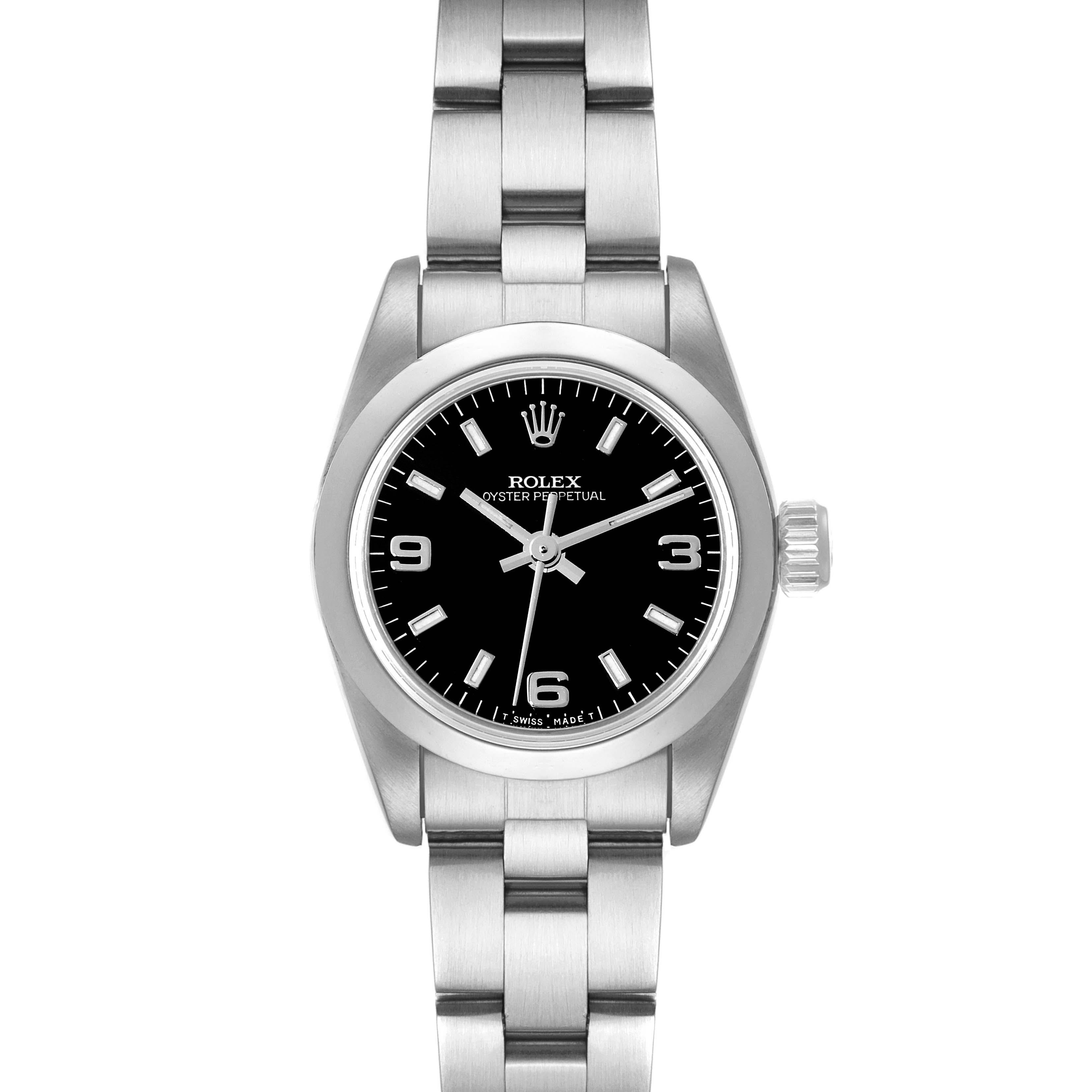 Rolex Oyster Perpetual Steel Black Dial Ladies Watch 67180 Papers. Officially certified chronometer automatic self-winding movement. Stainless steel oyster case 24.0 mm in diameter. Rolex logo on a crown. Stainless steel smooth domed bezel. Scratch