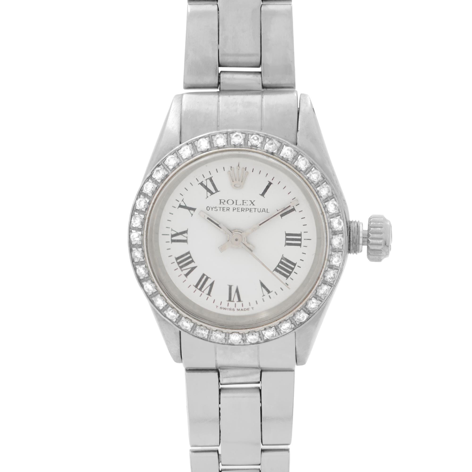 Pre Owned Rolex Oyster Perpetual Ladies Watch 6718. Custom White Gold Bezel with Diamonds. Moderate slack on the band. White Dial With Silver-Tone Hands. And Roman Numeral Hour Markers. No Original Box and Papers are Included. Comes with Chronostore