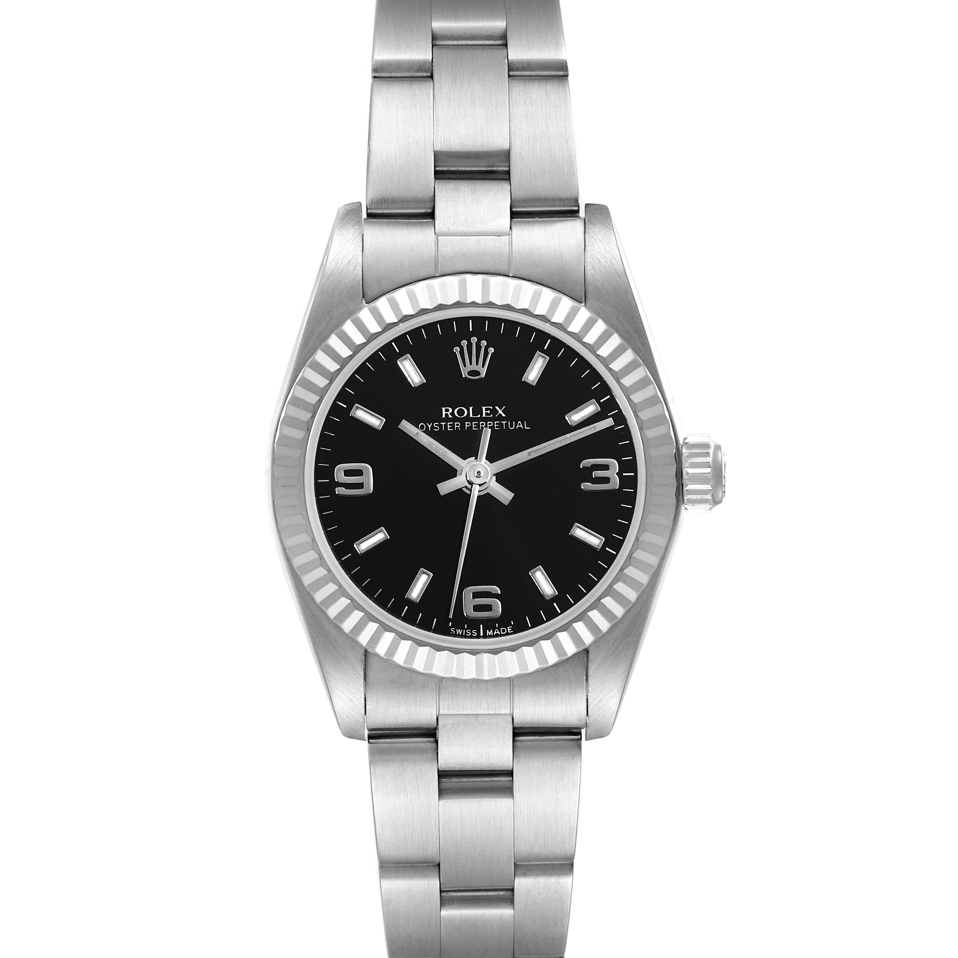 Rolex Oyster Perpetual Steel White Gold Ladies Watch 76094 Box Papers. Officially certified chronometer automatic self-winding movement. Stainless steel oyster case 24.0 mm in diameter. Rolex logo on the crown. 18k white gold fluted bezel. Scratch