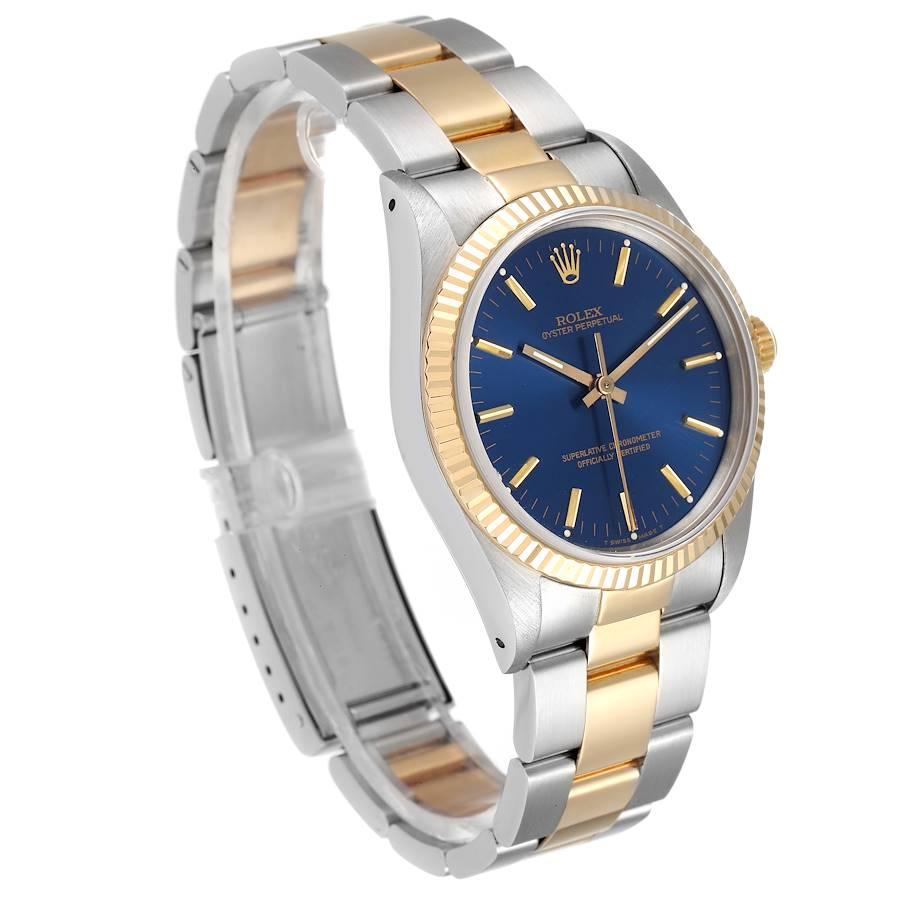 Rolex Oyster Perpetual Steel Yellow Gold Blue Dial Mens Watch 14233 In Excellent Condition For Sale In Atlanta, GA