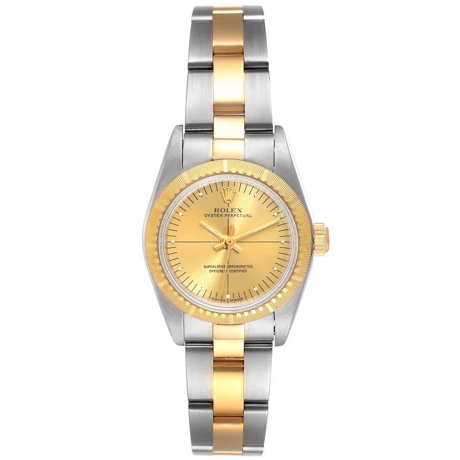 Rolex Oyster Perpetual Steel Yellow Gold Champagne Dial Ladies Watch 76243. Officially certified chronometer self-winding movement. Stainless steel oyster case 24.0 mm in diameter. Rolex logo on a 18k yellow gold crown. 18k yellow gold engine turned