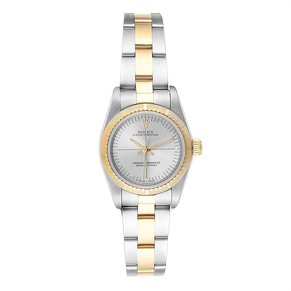 Rolex Oyster Perpetual Steel Yellow Gold Ladies Watch 76243 Box Papers. Officially certified chronometer self-winding movement. Stainless steel oyster case 24.0 mm in diameter. Rolex logo on a 18k yellow gold crown. 18k yellow gold engine turned