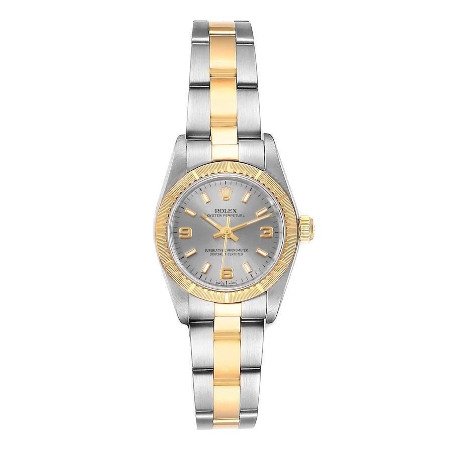 Rolex Oyster Perpetual Steel Yellow Gold Ladies Watch 76243. Officially certified chronometer self-winding movement. Stainless steel oyster case 24.0 mm in diameter. Rolex logo on a 18k yellow gold crown. 18k yellow gold engine turned bezel. Scratch