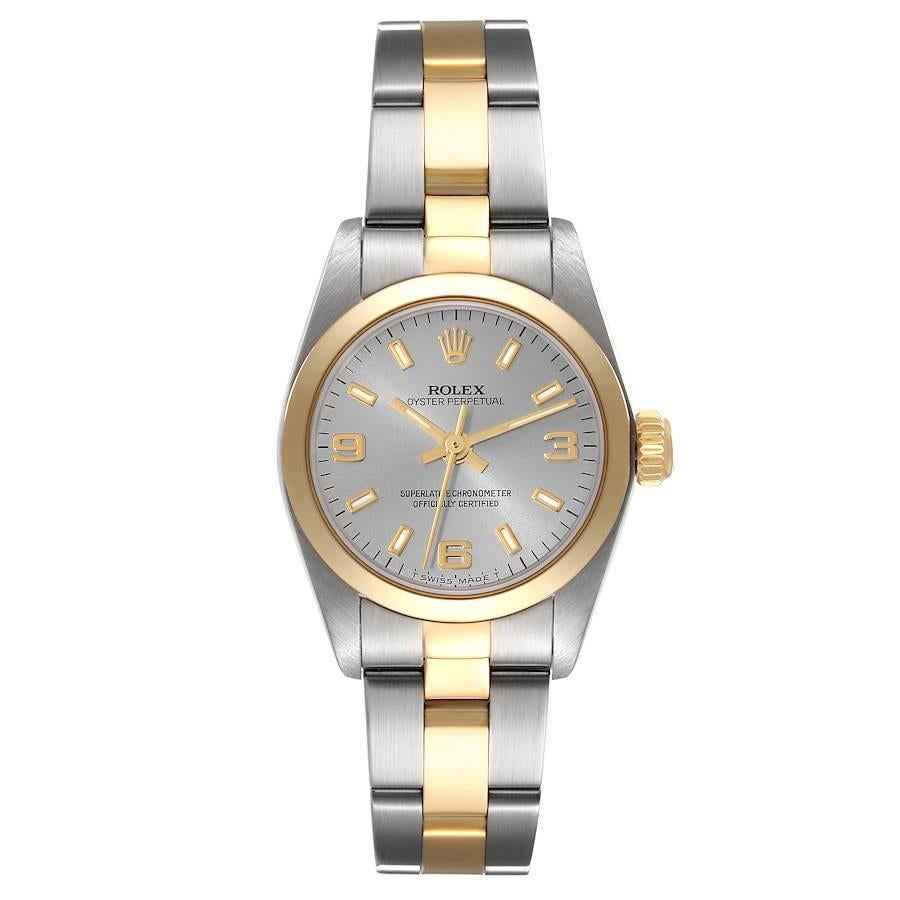 Rolex Oyster Perpetual Steel Yellow Gold Slate Dial Ladies Watch 67183. Officially certified chronometer self-winding movement. Stainless steel oyster case 24.0 mm in diameter. Rolex logo on an 18k yellow gold crown. 18k yellow gold smooth bezel.