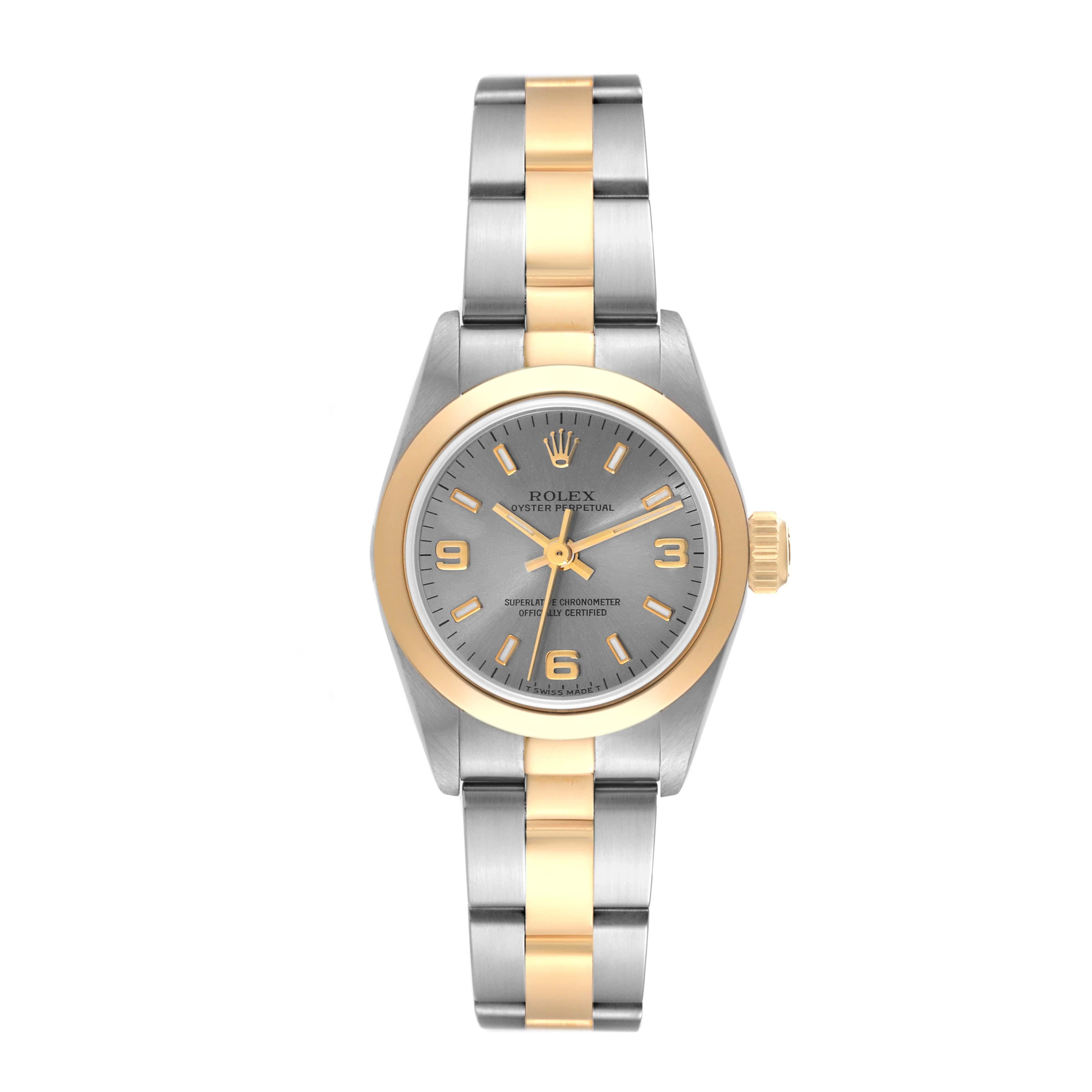 Rolex Oyster Perpetual Steel Yellow Gold Slate Dial Ladies Watch 67183. Officially certified chronometer automatic self-winding movement. Stainless steel oyster case 24.0 mm in diameter. Rolex logo on an 18k yellow gold crown. 18k yellow gold smooth