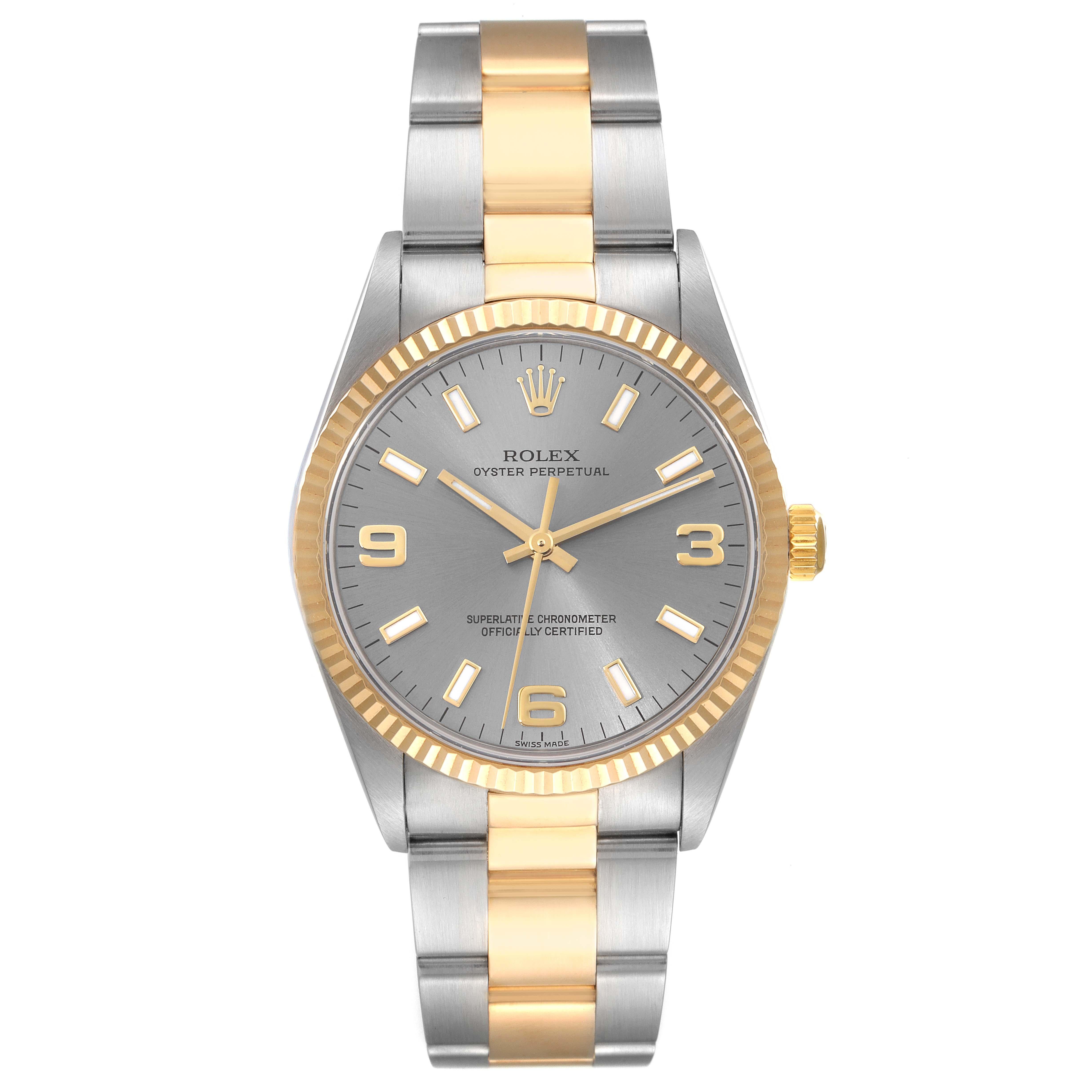 Rolex Oyster Perpetual Steel Yellow Gold Slate Dial Mens Watch 14233. Officially certified chronometer automatic self-winding movement. Stainless steel and 18K yellow gold oyster case 34.0 mm in diameter. Rolex logo on a crown. 18K yellow gold
