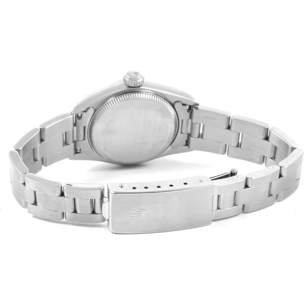 Rolex Oyster Perpetual White Dial Oyster Bracelet Ladies Watch 67230. Officially certified chronometer self-winding movement. Stainless steel oyster case 24.0 mm in diameter. Rolex logo on a crown. Stainless steel engine turned bezel. Scratch