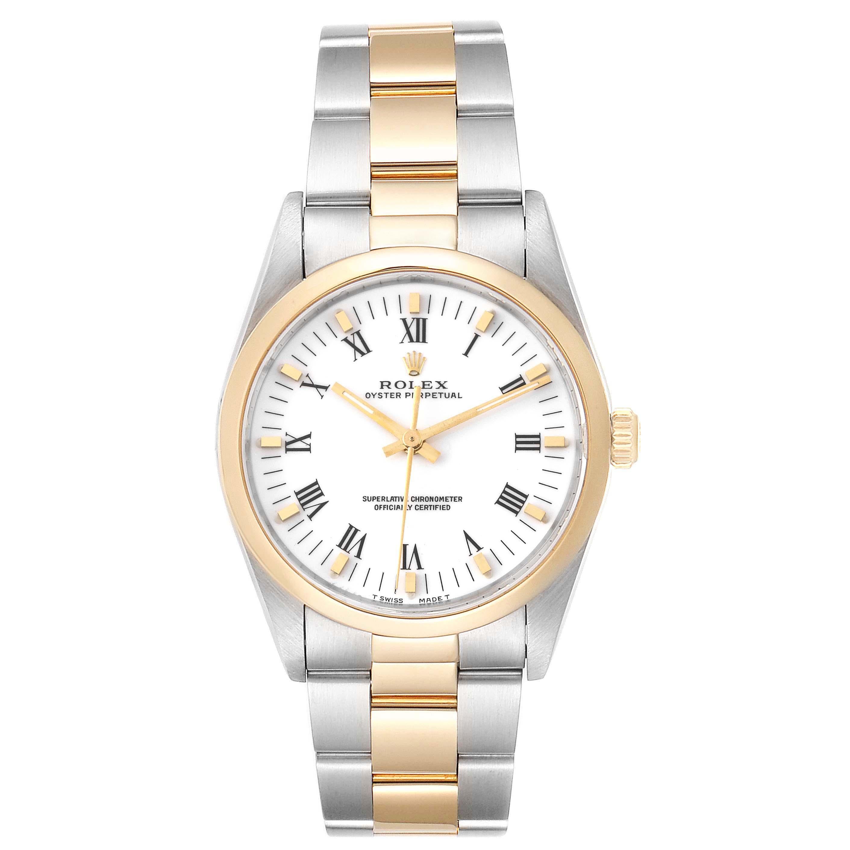 Rolex Oyster Perpetual White Dial Steel Yellow Gold Mens Watch 14203. Officially certified chronometer self-winding movement. Stainless steel and 18K yellow gold oyster case 34.0 mm in diameter. Rolex logo on a crown. 18K yellow gold smooth domed