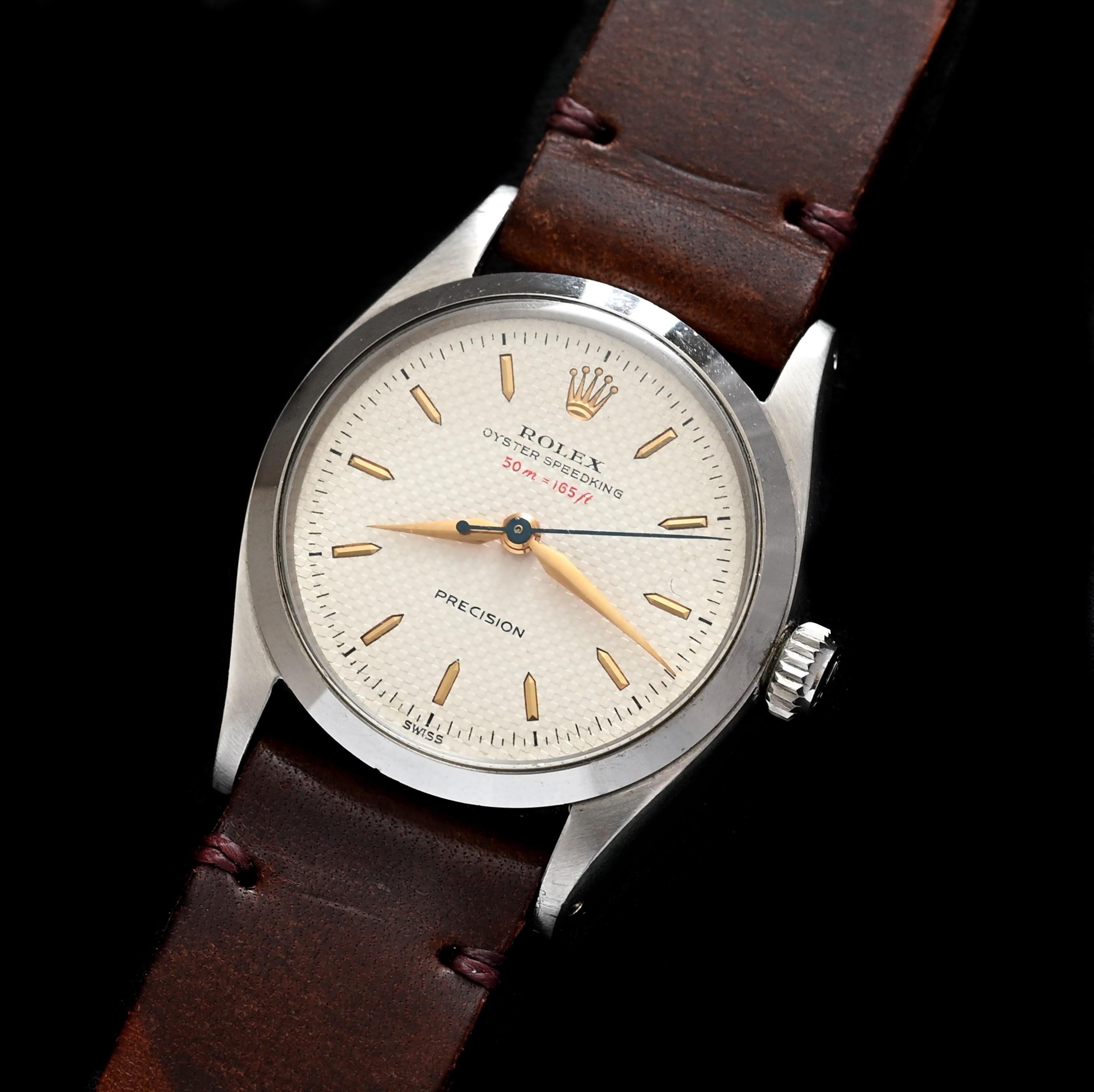 Brand: Vintage Rolex
Model: 6420
Year: 1955
Serial number: 72xxx

Reference: OT1868

Introducing a captivating 30mm Rolex Oyster featuring a unique white honeycomb dial Ref:6420, enhanced by a striking red depth rate indicator.  The distinctive