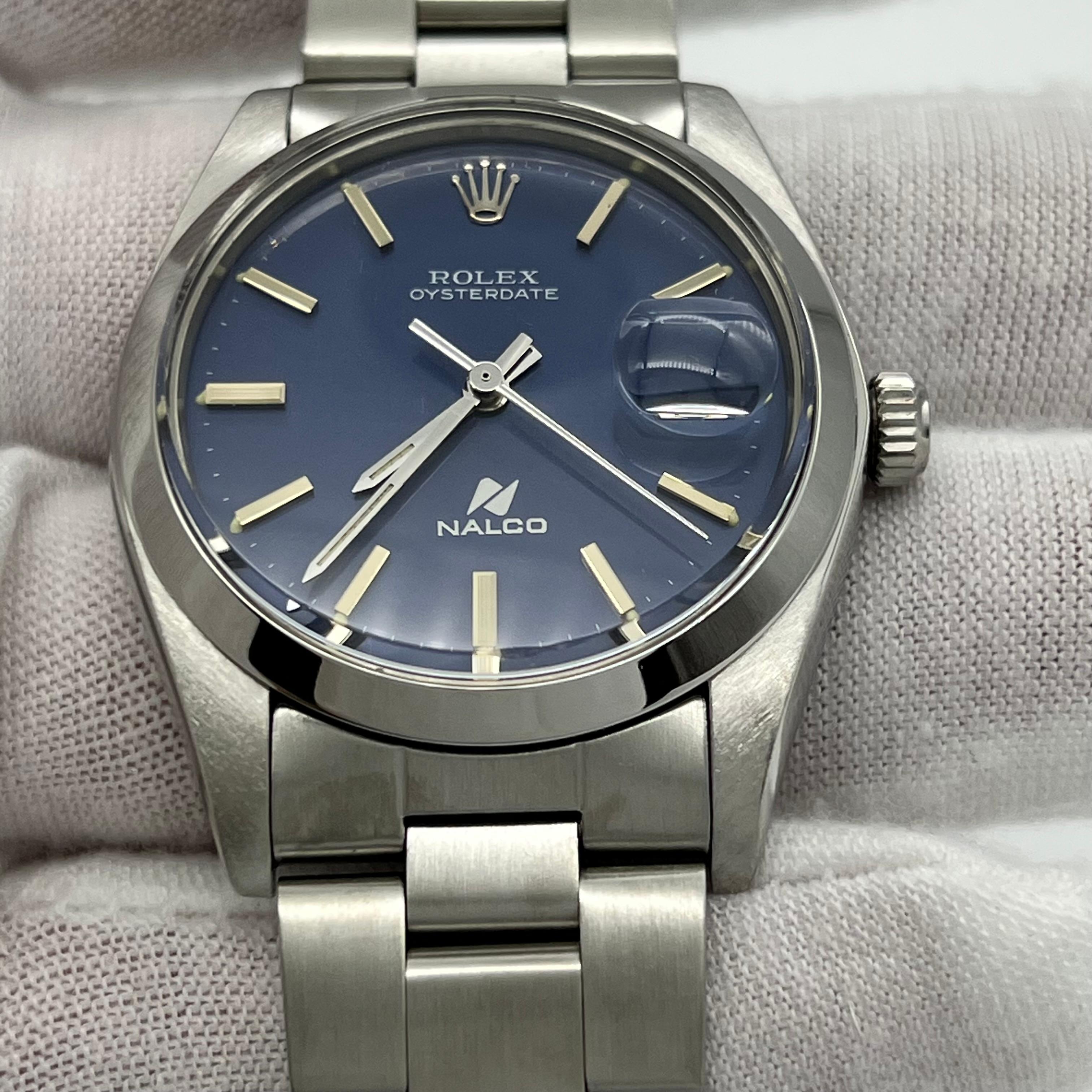 Stilnummer: 6694



Seriennummer: 6698***



Jahr: 1981

 

Modell: Rolex Oysterdate

 

MATERIAL des Gehäuses: Rostfreier Stahl

 

Band: Rostfreier Stahl

  

Lünette: Edelstahl

  

Zifferblatt: Seltenes blaues Nalco-Zifferblatt

 

Gesicht: