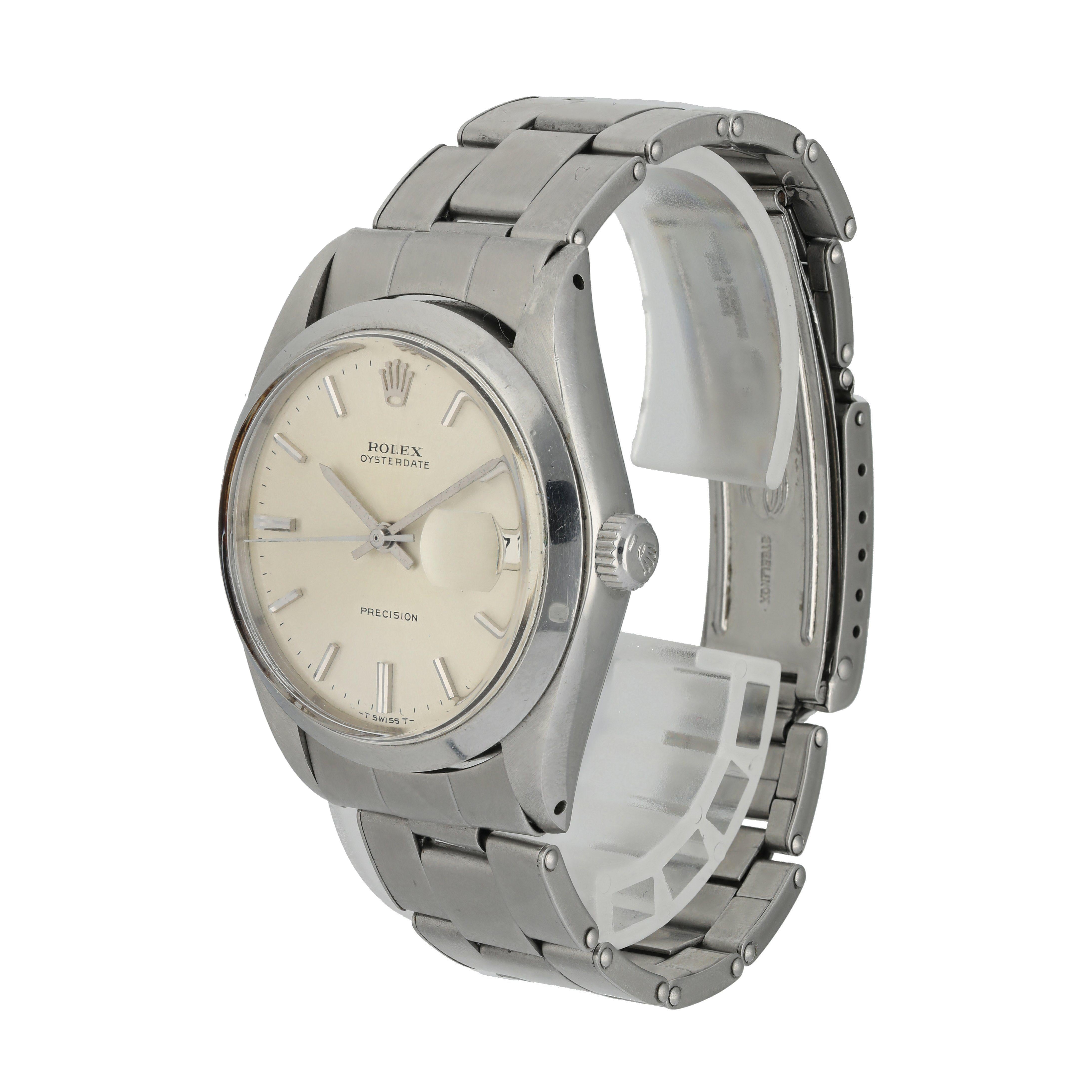 Rolex OysterDate Precision 6694 Vintage Men's Watch. 
34mm stainless steel case with a smooth bezel. 
Silver dial with silver-tone hands and indexes. 
Minute markers on the outer dial. 
Date Display at the 3 o'clock position. 
vintage rivet