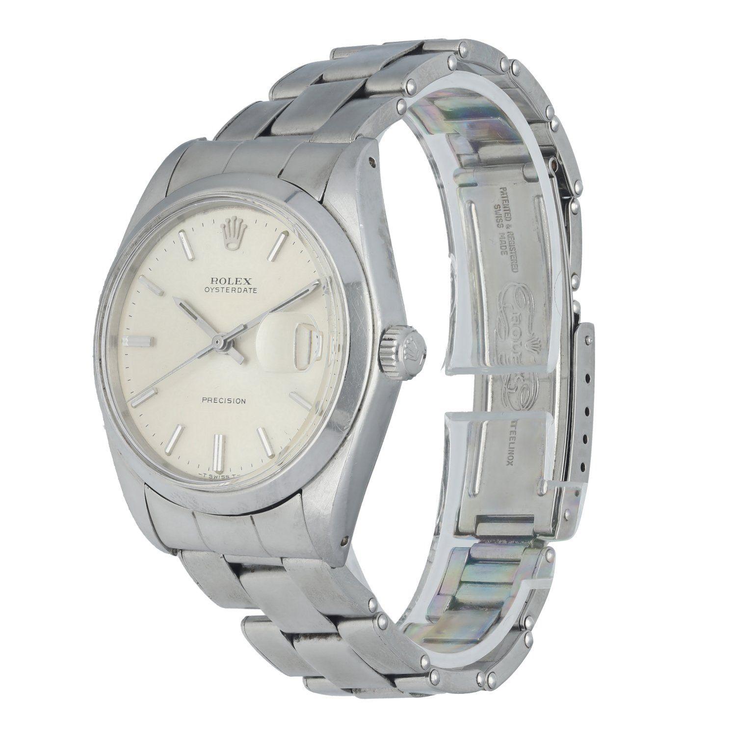 Rolex OysterDate Precision 6694 Vintage Men's Watch. 34mm stainless steel case with a smooth bezel. Silver dial with silver-tone hands and indexes. Minute markers on the outer dial. Date Display at the 3 o'clock position. Vintage rivet stainless