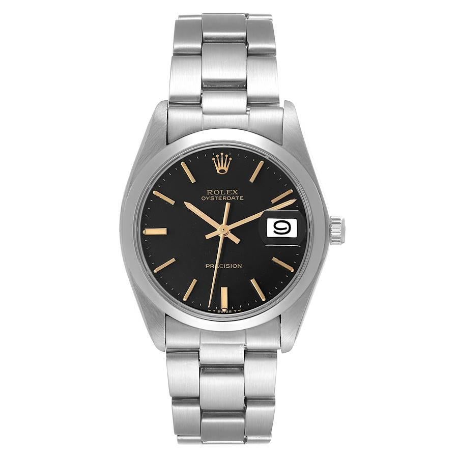 Rolex OysterDate Precision Black Gilt Dial Vintage Steel Mens Watch 6694. Manual-winding movement. Stainless steel oyster case 35.0 mm in diameter. Rolex logo on the crown. Stainless steel smooth bezel. Acrylic crystal with cyclops magnifier. Black