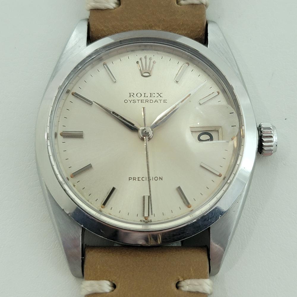 Iconic classic, Men's Rolex Oysterdate Precision 6694 hand-wind dress watch, c.1962, in excellent working condition. Verified authentic by a master watchmaker. Gorgeous Rolex signed silver dial, applied baton index hour markers, silver Rolex lance