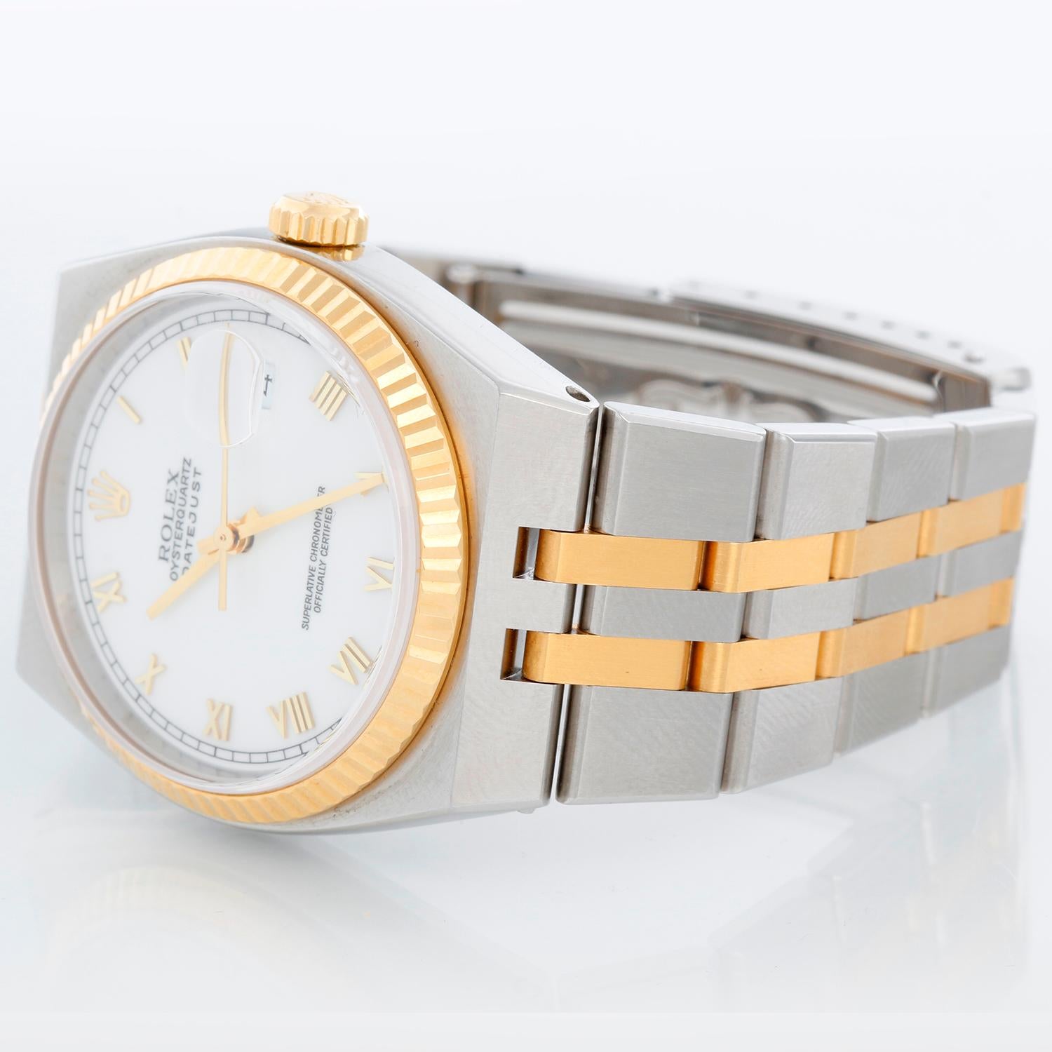 Rolex Oysterquartz Datejust 2-Tone Men's Watch 17013 - Quartz, Quickset date, sapphire crystal. Stainless steel case with yellow gold fluted bezel. White dial with raised gold Roman markers. Stainless steel and yellow gold Oyster bracelet; Fits a 7