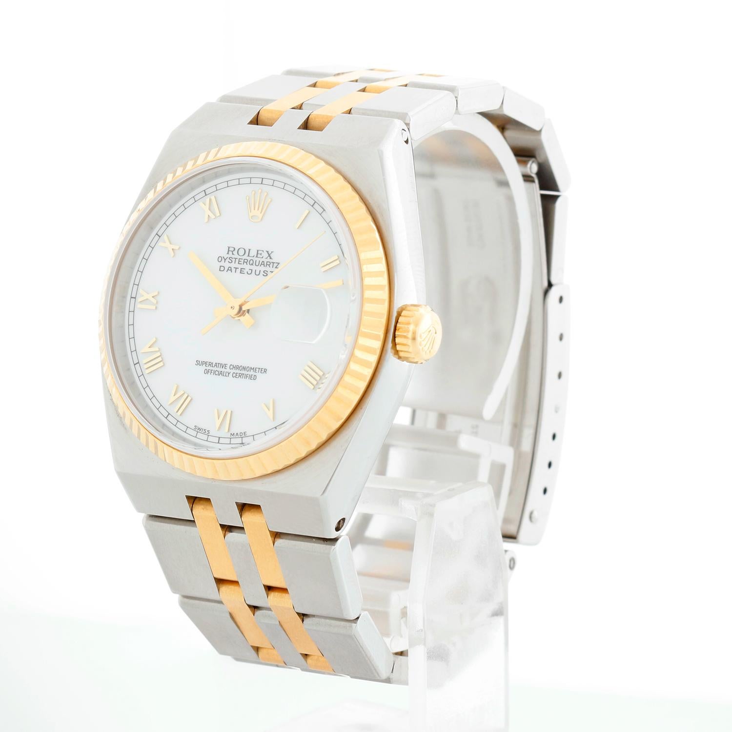 Rolex Oysterquartz Datejust 2-Tone Men's Watch 17013 - Quartz, Quickset date, sapphire crystal. Stainless steel case with yellow gold fluted bezel. White dial with raised gold Roman markers. Stainless steel and yellow gold Oyster bracelet; Fits a 7
