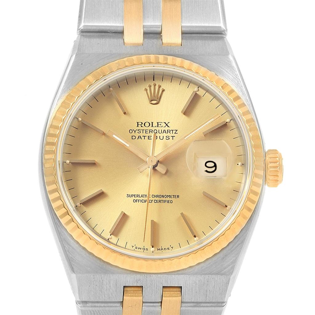 Rolex Oysterquartz Datejust 36 Steel Yellow Gold Mens Watch 17013. Quartz movement. Stainless steel oyster case 36 mm in diameter. Rolex logo on a crown. 18k yellow gold fluted bezel. Scratch resistant sapphire crystal with cyclops magnifier.