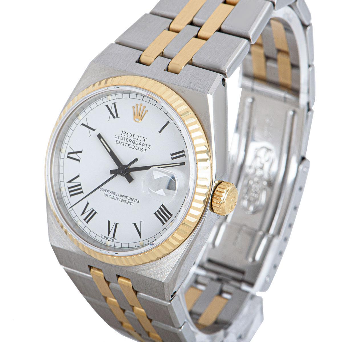 A 36 mm Stainless Steel and 18k Yellow Gold Oysterquartz Datejust Gents Wristwatch, silver dial with applied hour markers, date at 3 0'clock, a fixed 18k yellow gold fluted bezel, a stainless steel and 18k yellow gold oysterquartz bracelet with a