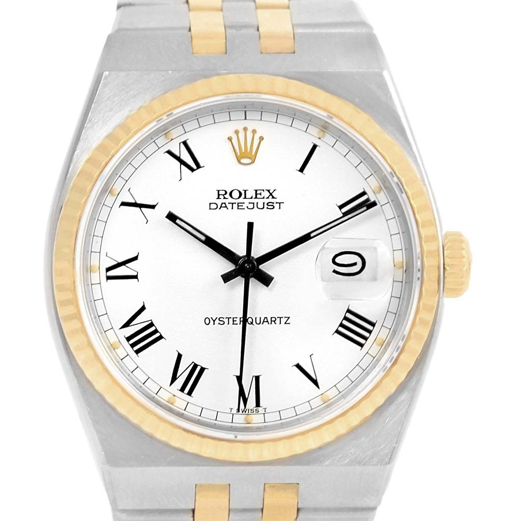 Rolex Oysterquartz Datejust Steel Yellow Gold Buckley Dial Watch 17013. Quartz movement. Stainless steel and 14K yellow gold oyster case 36.0 mm in diameter. Rolex logo on a crown. White Buckley dial with roman numerals. Date window at 3 o'clock