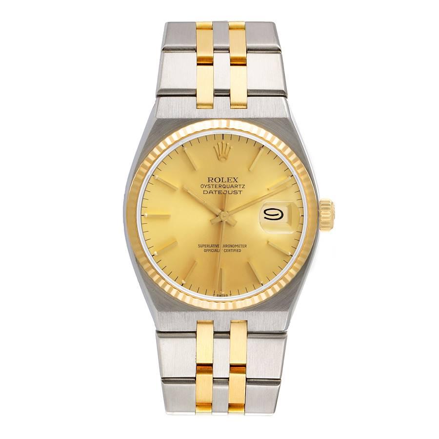 Rolex Oysterquartz Datejust Steel Yellow Gold Mens Watch 17013. Quartz movement. Stainless steel oyster case 36 mm in diameter. Rolex logo on a crown. 18k yellow gold fluted bezel. Scratch resistant sapphire crystal with cyclops magnifier. Champagne