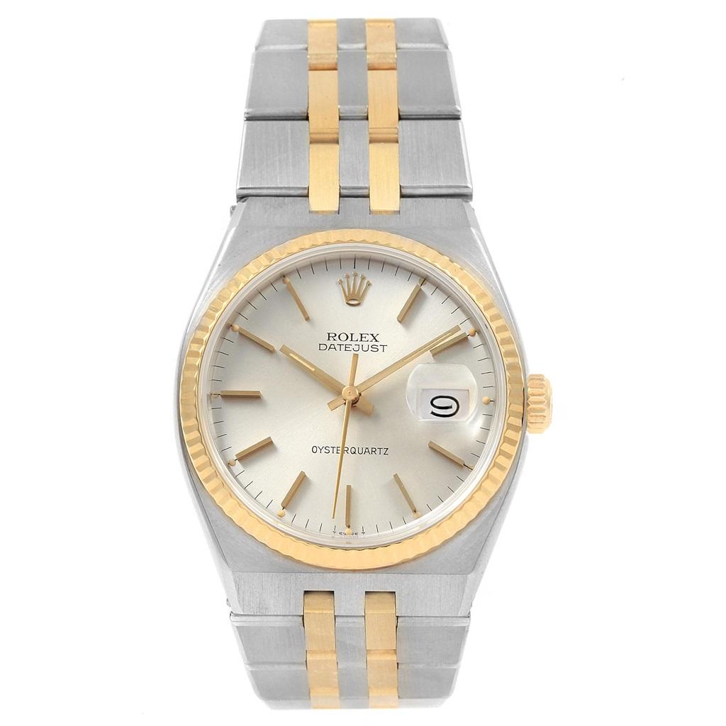 Rolex Oysterquartz Datejust Steel Yellow Gold Silver Dial Watch 17013. Quartz movement. Stainless steel oyster case 36 mm in diameter. Rolex logo on a crown. 18k yellow gold fluted bezel. Scratch resistant sapphire crystal with cyclops magnifier.