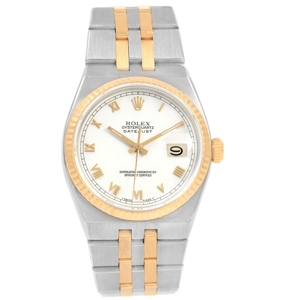 Rolex Oysterquartz Datejust Steel Yellow Gold White Dial Watch 17013. Quartz movement. Stainless steel oyster case 36.0 mm in diameter. Rolex logo on a crown. 18k yellow gold fluted bezel. Scratch resistant sapphire crystal with cyclops magnifier.
