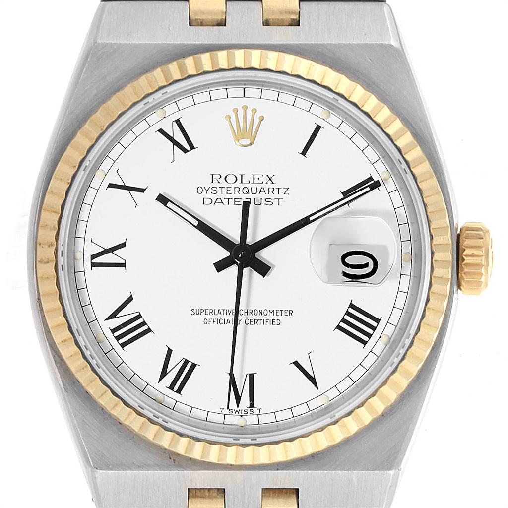 Rolex Oysterquartz Datejust Steel Yellow Gold White Dial Watch 17013. Quartz movement. Stainless steel and 14K yellow gold oyster case 36 mm in diameter. Rolex logo on a crown. 14k yellow gold fluted bezel. Scratch resistant sapphire crystal with