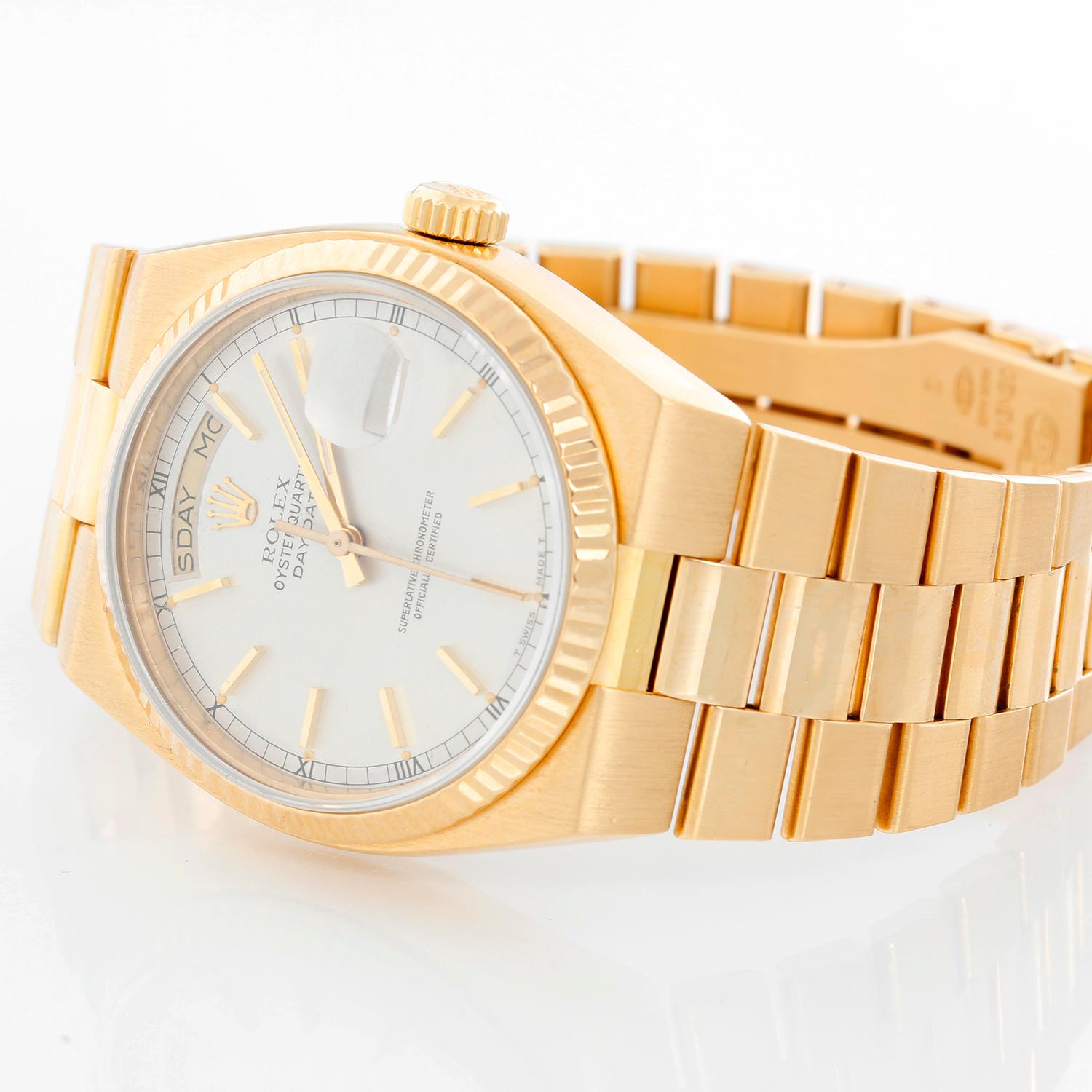 Rolex Oysterquartz Day-Date Men's 18K Gold President Watch 19018 - Quartz; quick-set; sapphire crystal. 18k yellow gold case with fluted bezel (36mm diameter); Has never been polished. Silver dial with raised gold Roman numerals. 18k yellow gold