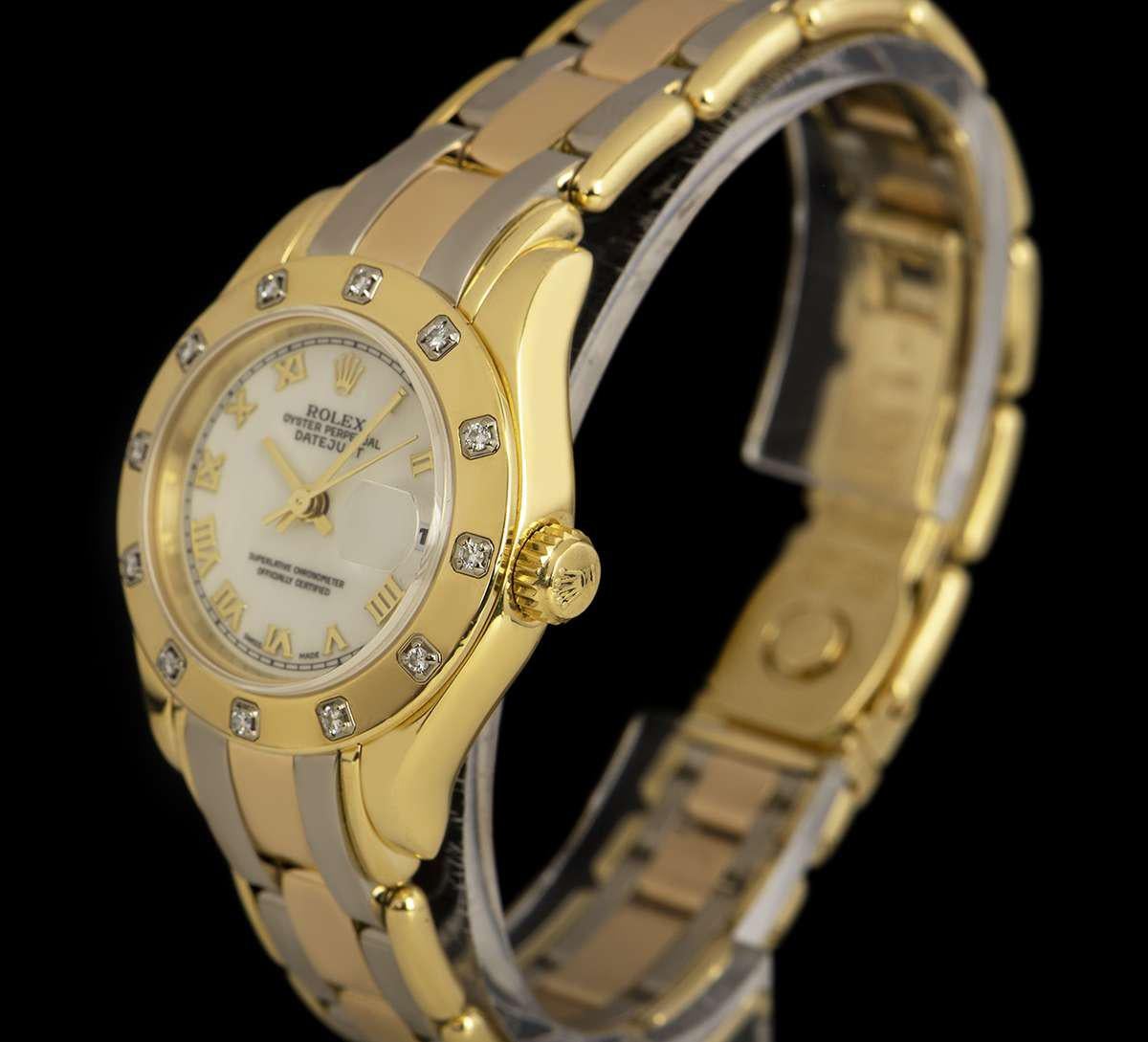 An Tridor Gold Oyster Perpetual Pearlmaster Datejust Ladies Wristwatch, white dial with applied roman numerals, date at 3 0'clock, a fixed yellow gold bezel set with 12 round brilliant cut diamonds (~0.15 ct), an tridor gold pearlmaster bracelet