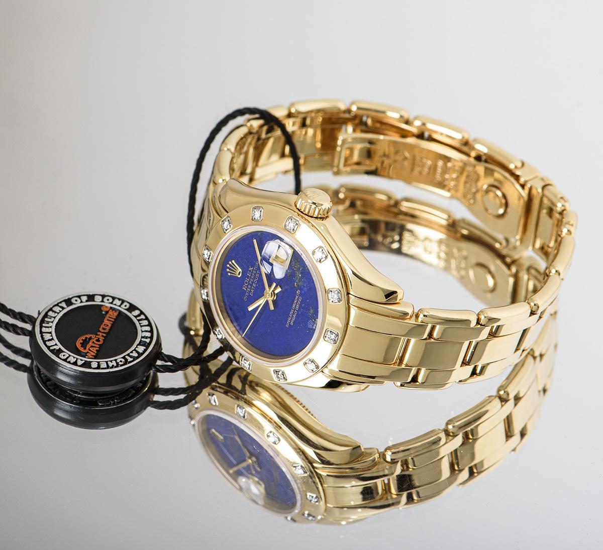 An 18k Yellow Gold Oyster Perpetual 29mm Pearlmaster Datejust Women's Wristwatch, rare lapis lazuli dial, date at 3 0'clock, a fixed 18k yellow gold bezel set with approximately 12 round brilliant cut diamonds, an 18k yellow gold pearlmaster