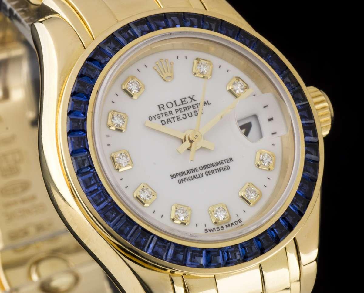 An 18k Yellow Gold Oyster Perpetual Pearlmaster Datejust Ladies Wristwatch, white dial with 10 applied round brilliant cut hour markers, a fixed 18k yellow gold bezel set with 40 baguette cut sapphires  (~1.93ct), an 18k yellow gold pearlmaster