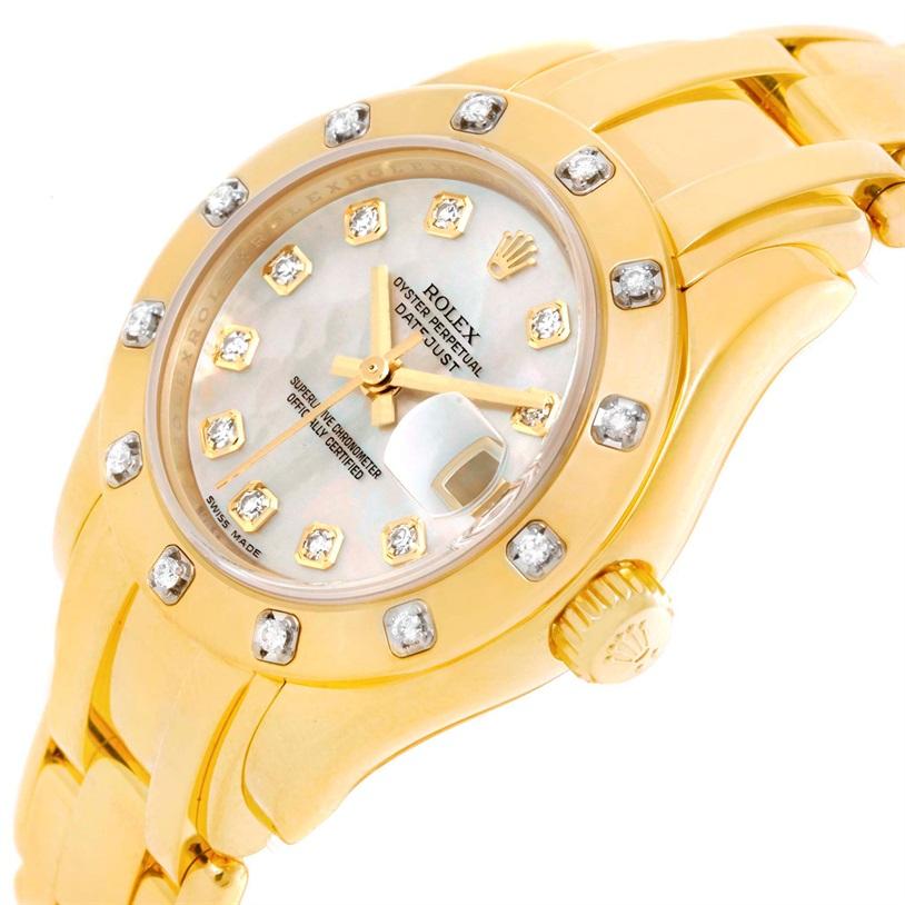 Rolex Pearlmaster Yellow Gold Mother Of Pearl Diamond Watch 80318. Officially certified chronometer self-winding movement with quickset date function. 18k yellow gold oyster case 29.0 mm in diameter. Rolex logo on a crown. Rolex factory diamond
