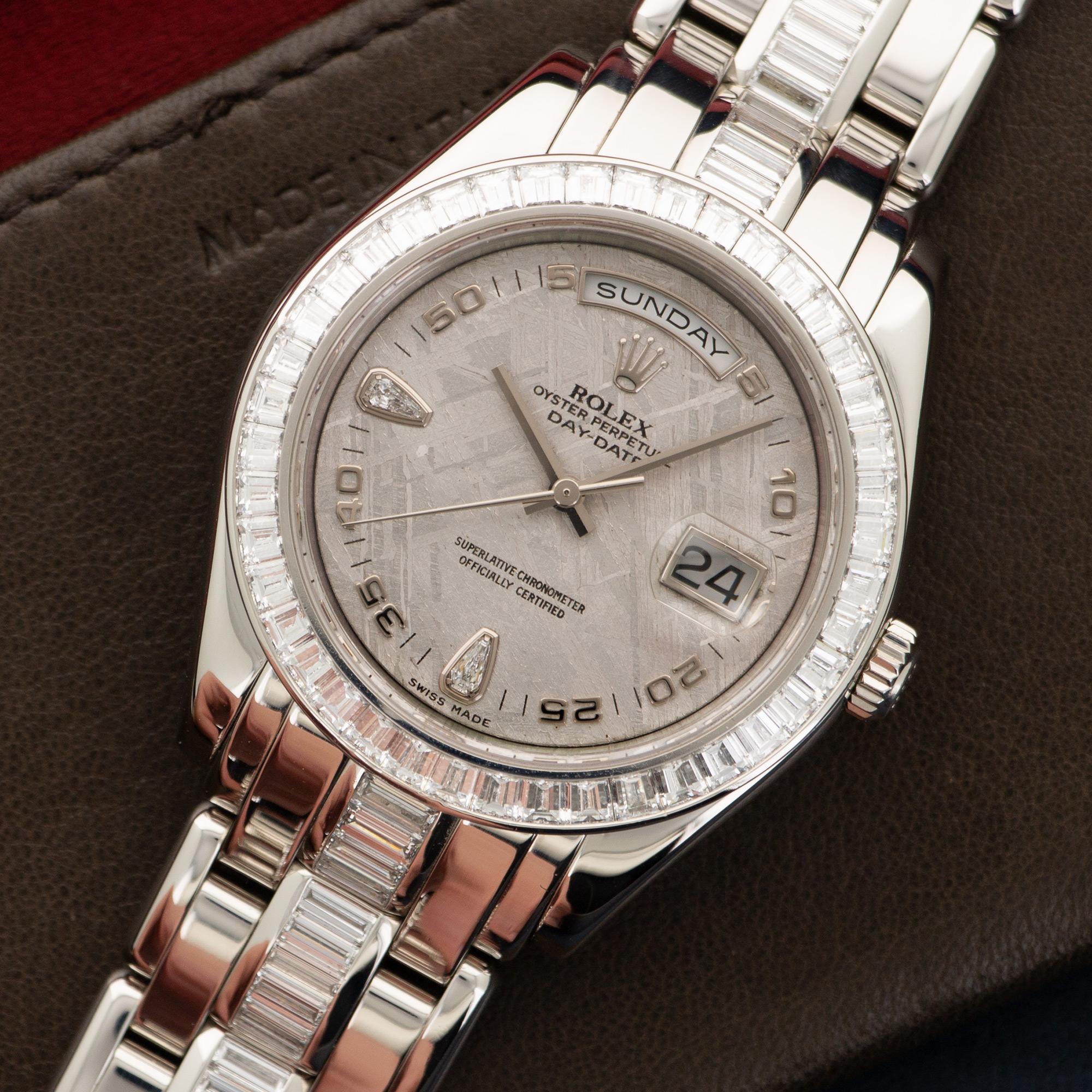 An All Original Platinum Day-Date Masterpiece with Original Baguette Diamond Bracelet, by Rolex. Model Number 18956. Automatic Movement. Meteriote Dial with Diamond Markers. Serial Number Dates the Watch to the Mid 2000's.