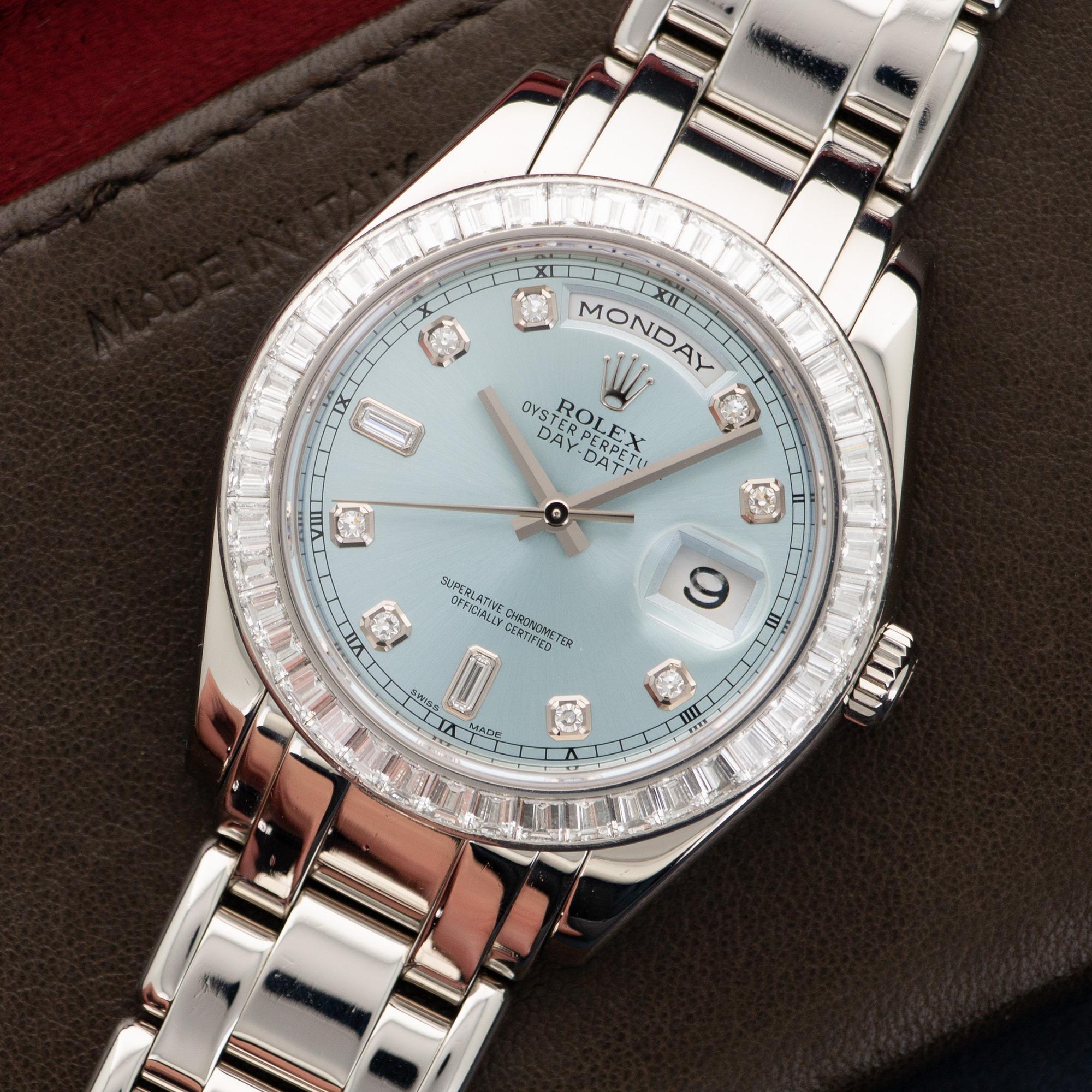 An Original Platinum Day-Date Masterpiece Watch with Original Square-Cut Diamond Bezel, by Rolex. Model Number 18956. Serial Number Dates the Watch to the Mid 2000's. 39mm Case Diameter. Glacier Blue Dial with Diamond Indexes. Comes in its Original