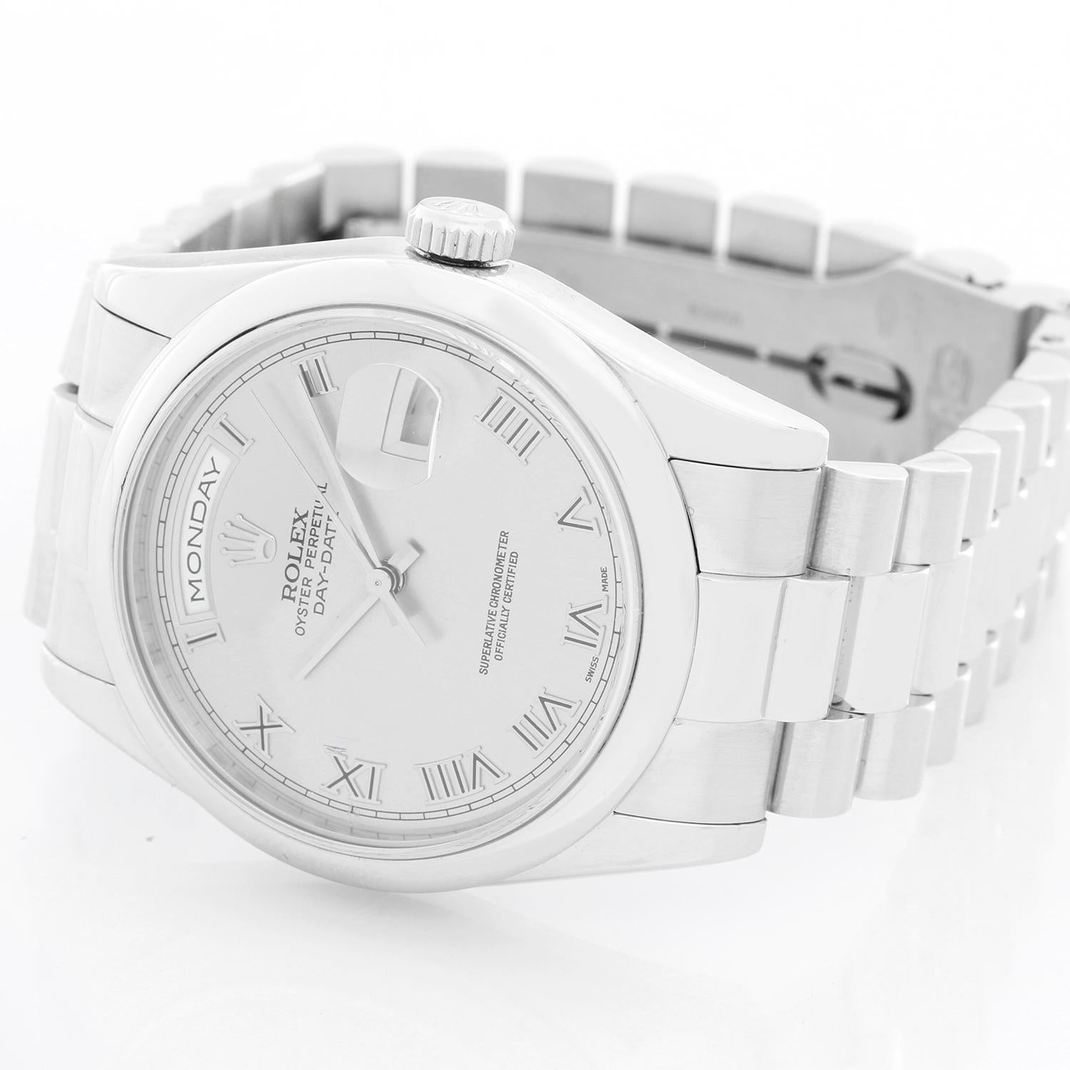 Rolex Platinum President  Day-Date Men's Watch 118206 - Automatic winding, 31 jewels, Quickset, sapphire crystal. Platinum case with smooth bezel . Rhodium Roman dial . Platinum hidden clasp President bracelet. Pre-owned with box and books.