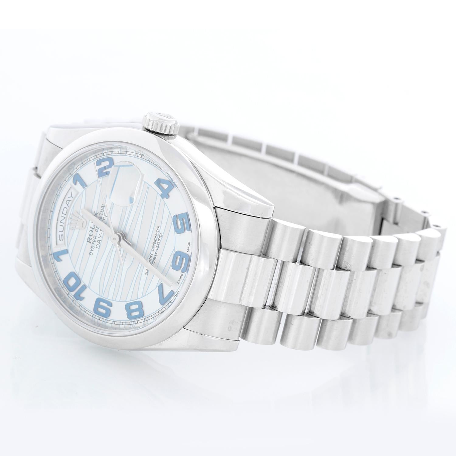 Rolex Platinum President  Day-Date Men's Watch 118206 - Automatic winding, 31 jewels, Quickset, sapphire crystal. Platinum case with smooth bezel . Glacier blue dial . Platinum hidden clasp President bracelet. Pre-owned with box and books.