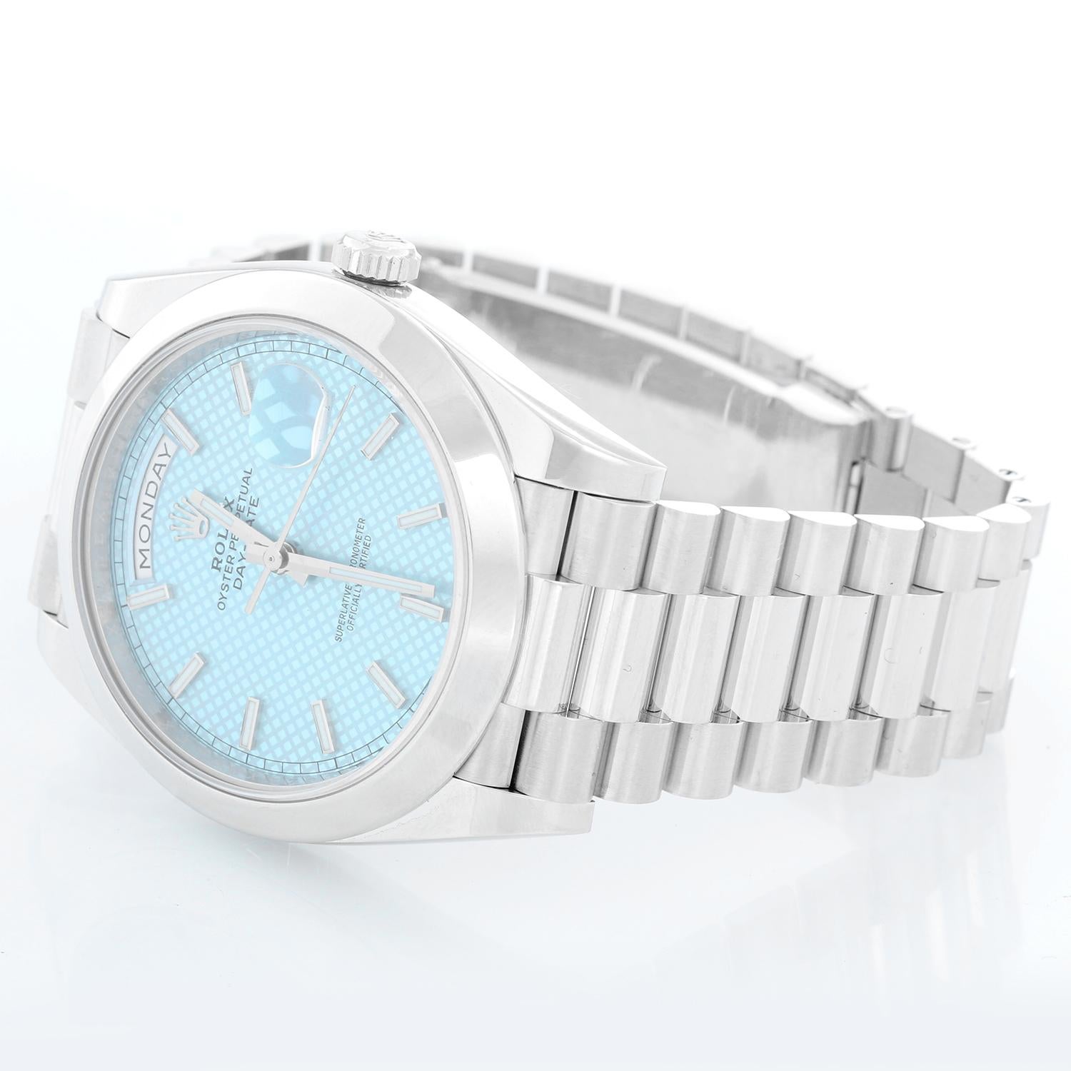 Rolex Platinum President  Day-Date Men's Watch 228206 - Automatic winding, 31 jewels, Quickset, sapphire crystal. Platinum case with smooth bezel ( 40 mm ). Ice Blue with dial markers and diagonal motif. Platinum hidden clasp President bracelet.