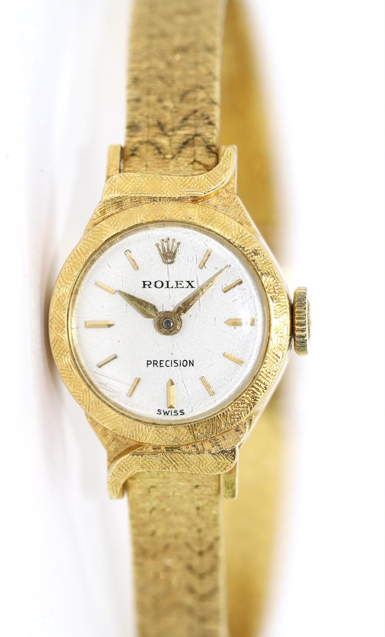 Elegant Rolex Precision 18 Karat Gold Ladies Wrist Watch.
Mechanical, manual Wind Movement.
Strap and case made of 18 Karat solid Yellow Gold.
Diameter measured without crown.

Including certificate of authenticity. 

