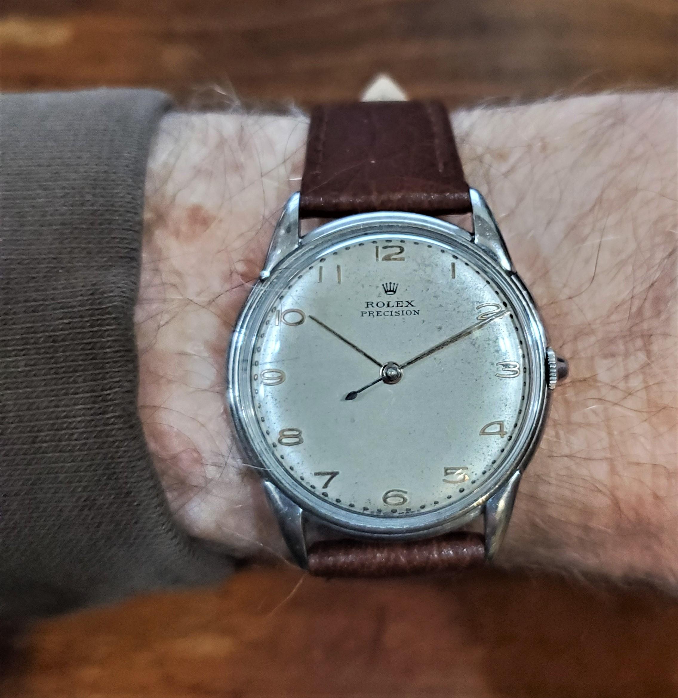Rolex Precision 4219 stainless steel  watch, circa 1950's.  The watch measures 35mm x 10mm thick.  With 17-jewel manual winding movement.  The case/serial # 057022.  The watch is 100% original, dial, case, crown. 

The dial is original and has a