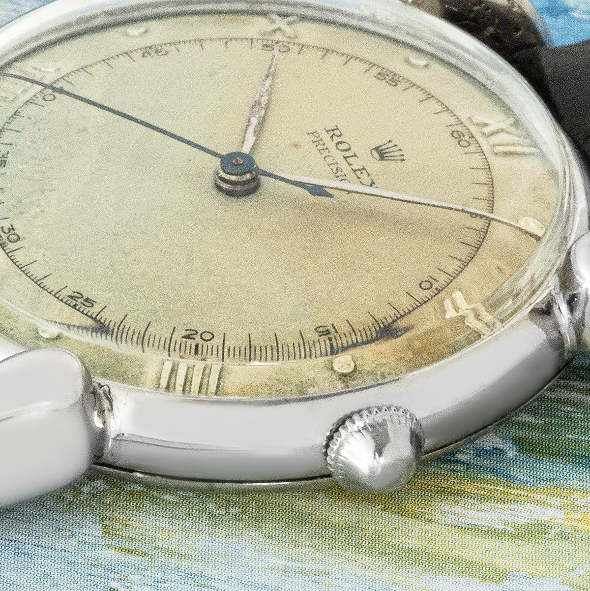 This vintage Rolex Precision ref. 4417, is a standout vintage timepiece, featuring a stainless steel case with elegant 'Tear Drop' lugs. Its original silver dial, with Roman numerals and a 60 seconds/minutes track, remains in good condition for its