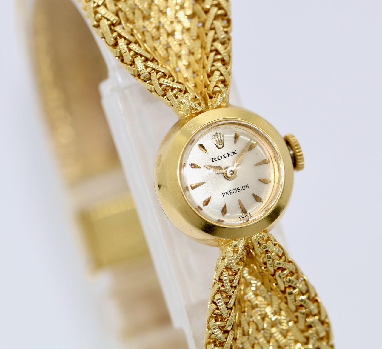 Beautiful and very rare Rolex Precision Bow Vintage Ladies Wrist Watch. Case and Strap 18 Karat Gold. 
Diameter without crown 15mm.
Total length 179mm
Manual winding movement.

Watch works properly. Including certificate of authenticity.