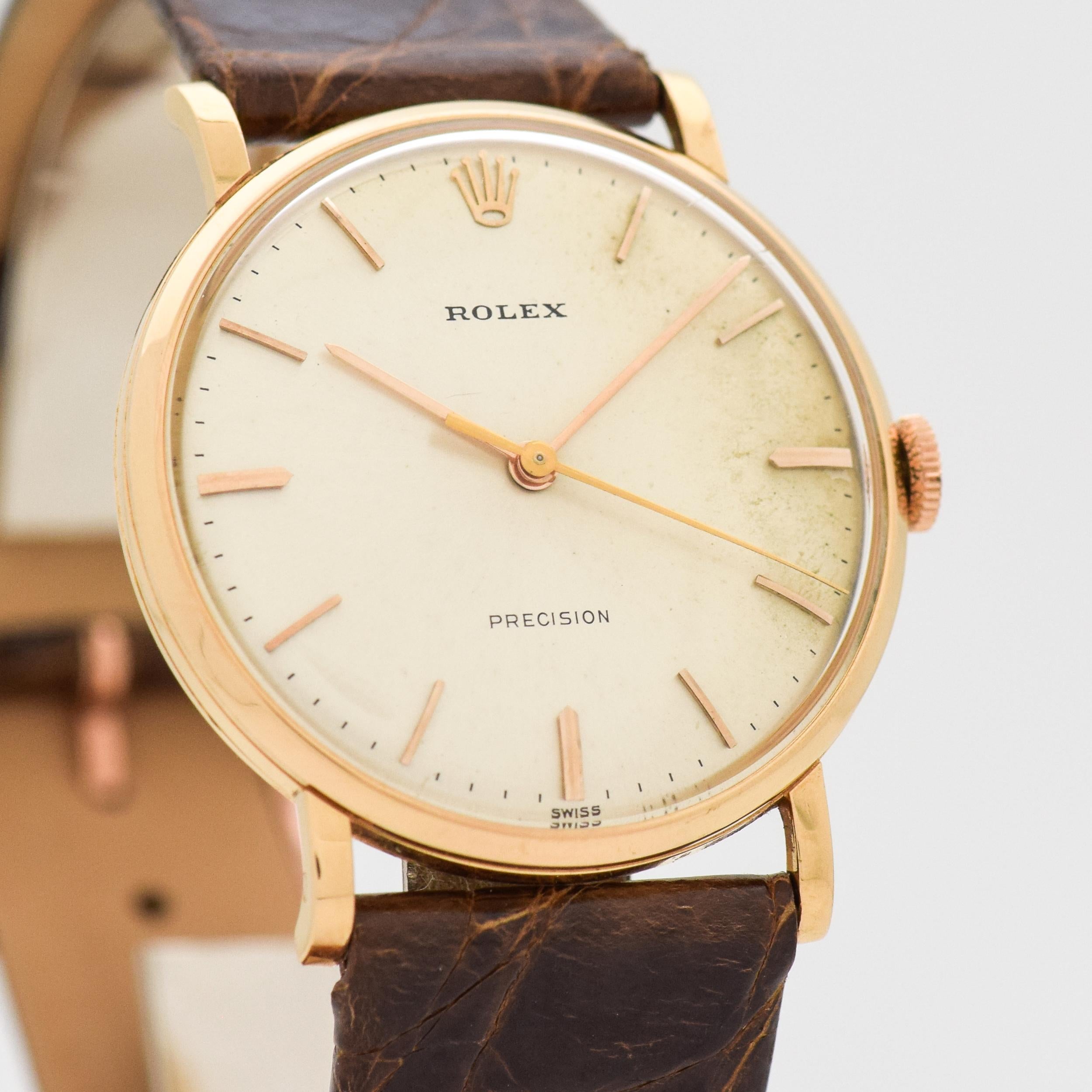 1958 Vintage Rolex Precision Ref. 9659 18k Light Rose Gold Case watch with Original Silver Dial with Applied Rose Gold Stick/Bar/Baton Markers. 33mm x 38mm lug to lug (1.3 in. x 1.5 in.) 17 jewel, automatic caliber 1215 movement. 100% Genuine